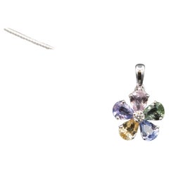 Ciondolo a fiore con zaffiro colorato 18 K.