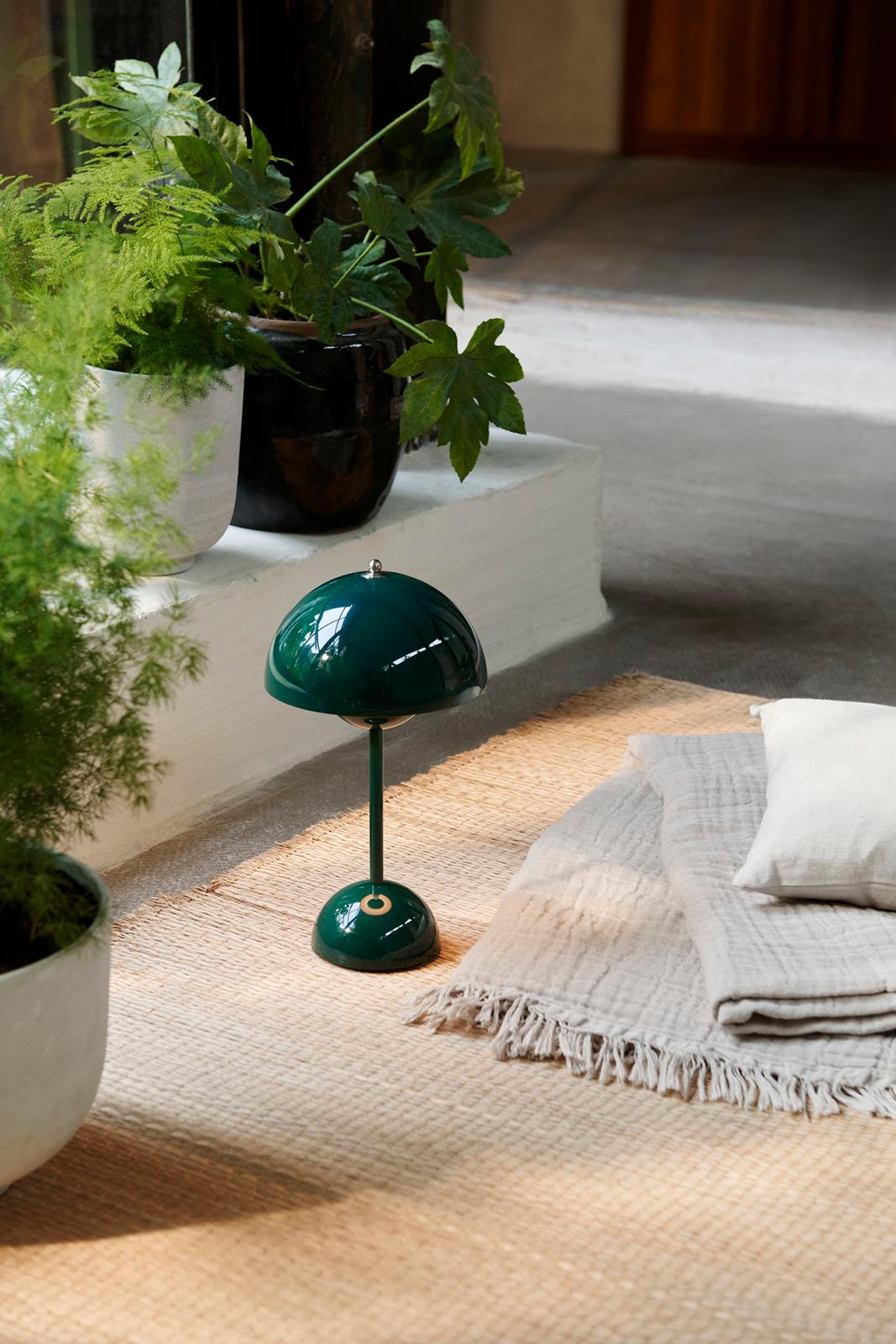 The Flowerpot, a vividly coloured lamp with a rounded pendant that hangs from the semi-domed upper shade,  design by Verner Panton 1968
Slightly smaller in size than the table lamp version, and deliberately lightweight, the portable VP9 comes