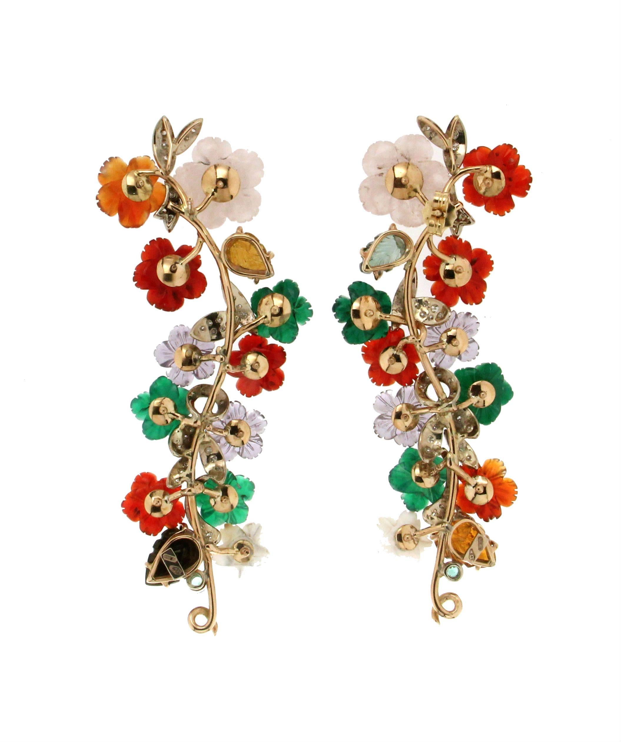 Flowers 14 Karat Yellow Gold Diamonds Stud Earrings.
the flowers are composed of carnelian, mother-of-pearl, agate,tourmaline and amethysts

Earrings Gold weight 17.80 grams
Earrings total weight 26.50 grams 
Diamonds weight 0.80 karat
Emeralds