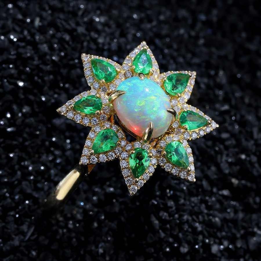 Flowers Design Australian Semi-Black Opal Diamond Tsavorite Engagement Ring 18K Yellow Gold.



Design Idea:


Here's another one of my latest designs! Featuring a Lightning Ridge Semi-black opal at the center, complemented by pear-shaped Tsavorites