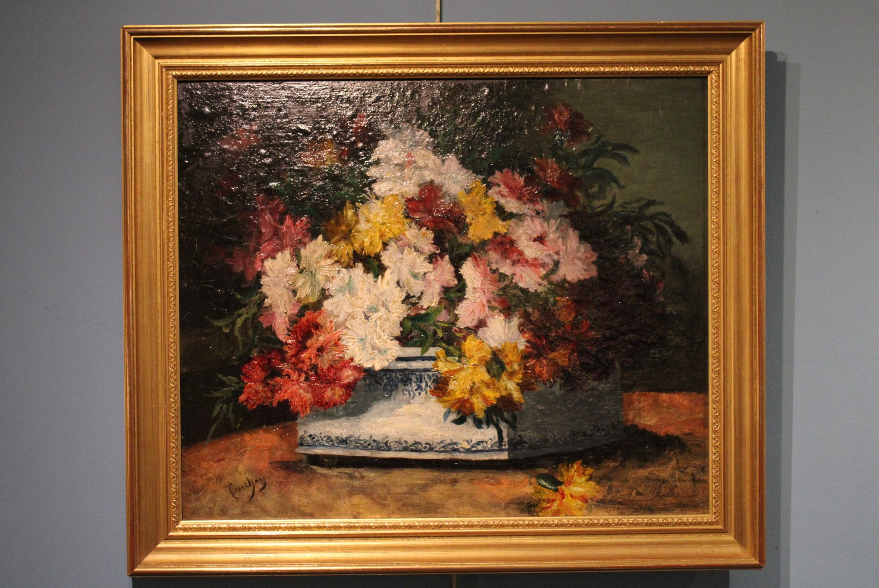 Basket of flowers, painting by Eugène Henri Cauchois (French painter, 1850-1911). 
Oil on panel, signed.
 Eugène Henri Cauchois is a genre painter, landscapes, seascapes and still lifes.
His works are kept in French museums : at Louviers,