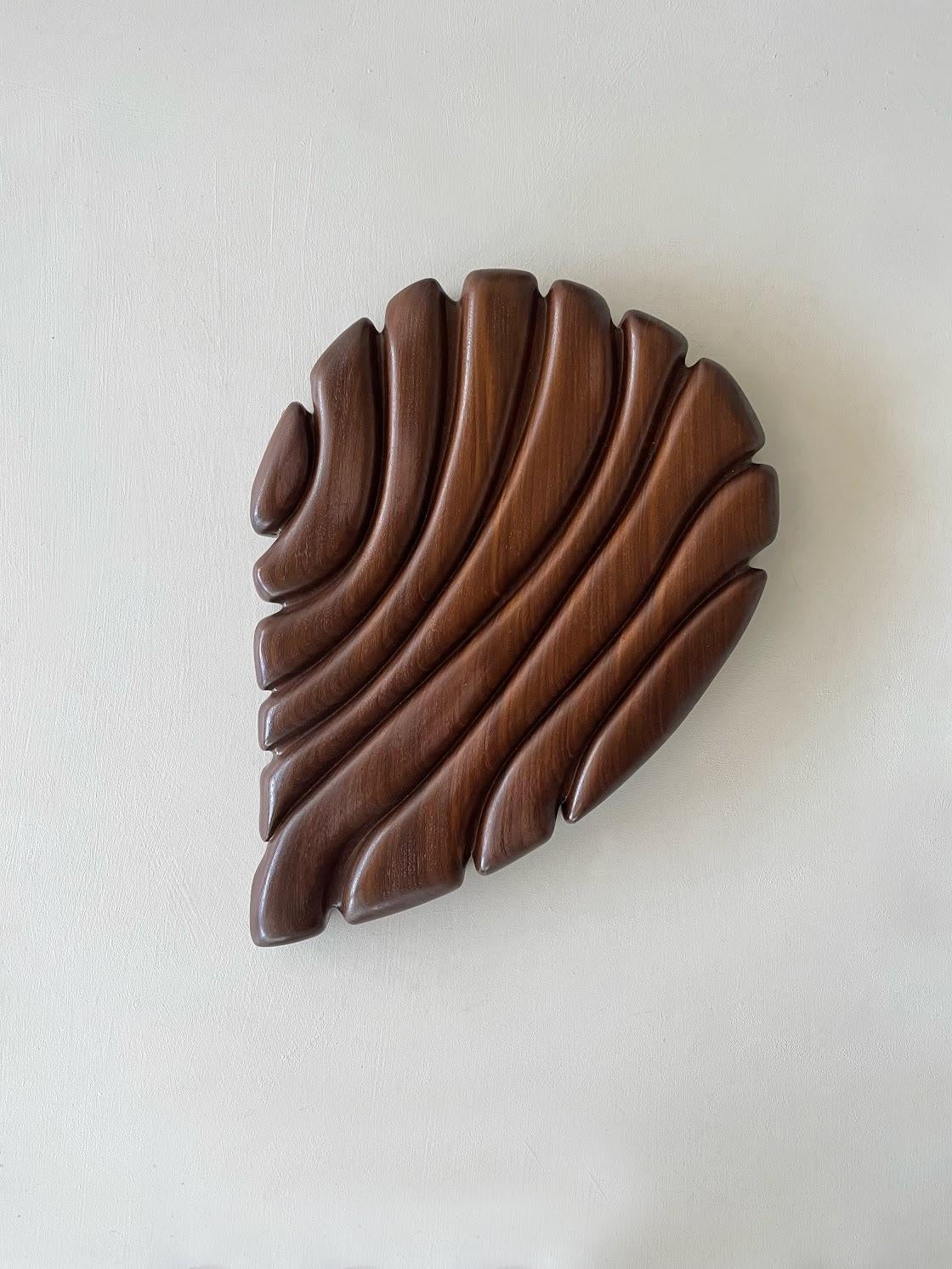 Fluentem Creatura Wall Sculpture by Eline Baas
Dimensions: D 5 x W 35 x H 45 cm
Materials: Solid oiled Afrormosia wood. 

STUDIO ELINE BAAS is an Amsterdam-based Interior Design studio. 

Whether it is a private home, office, restaurant, hotel or
