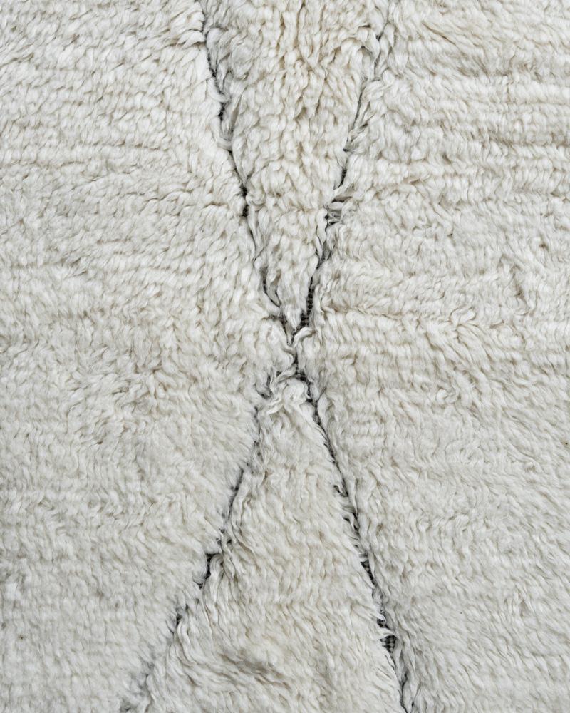 Fluffy Collection erased ivory Charcoal hand knotted rug 9' x 12'. Using the finest of wools these hand-woven recreations of Moroccan classic designs bring a feeling of warmth and luxury to any setting. This rug has an erased look that adds a touch