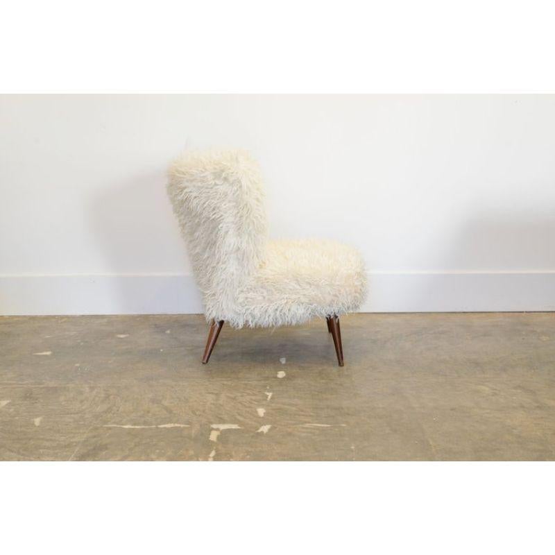 Fluffy lounge chair in faux fur c. 1950's

Designer: unknown

Materials: White faux fur and stained beechwood legs. Character enhanced by patina and wear.

Approx Dims: 20