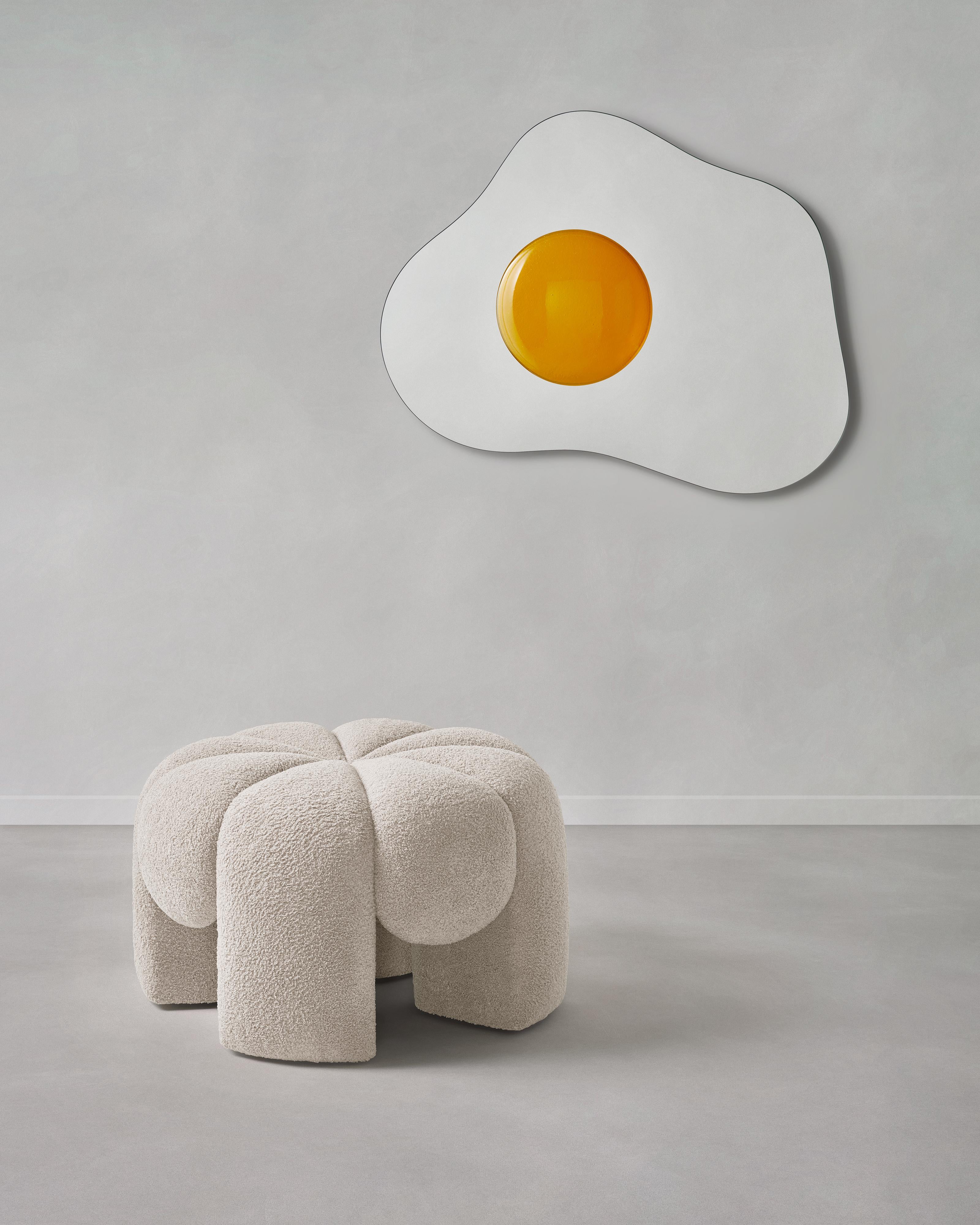‚Big Marshmallow‘ is a fluffy puffy pouf designed by Paul Ketz. 

Inspired by the natural drip and motion of rising and overflowing dough the design interweaves classic elegance and playfulness.

Big Marshmallow is upholstered with an exclusive