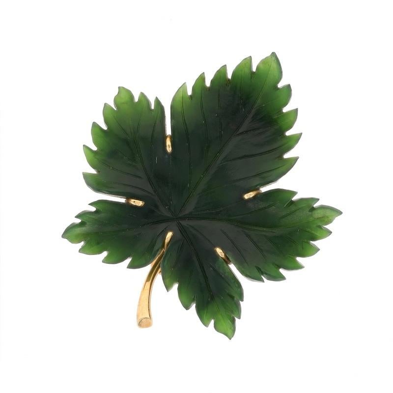 Brand: Fluhler
Era: Vintage

Metal Content: 14k Yellow Gold

Stone Information

Natural Nephrite Jade
Treatment: Routinely Enhanced
Cut: Carved
Color: Green

Style: Brooch
Fastening Type: Hinged Pin and Whale Tail Bullet Clasp
Theme: Leaf,