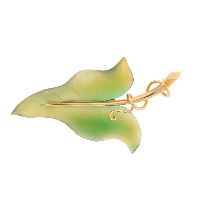 Brand: Fluhler
Era: Vintage

Metal Content: 14k Yellow Gold

Stone Information

Natural Nephrite Jade
Treatment: Routinely Enhanced
Cut: Carved
Color: Green

Style: Brooch
Fastening Type: Hinged Pin and Whale Tail Bullet Clasp
Theme: Leaf & Vine,