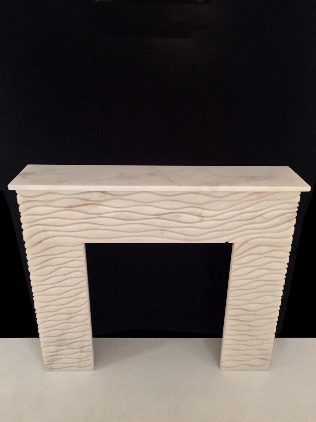 Fluid Fire fireplace by Jean-Fréderic Bourdier
Dimensions: D 20 x W 119 x H 102 cm
Materials: White Estremoz marble.

Mostly guided by his sculptor skills JFB and his life time strong attraction for nature, has started out this collection in