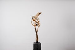 Tabletop sculpture in polished bronze referencing the form of a treble clef
