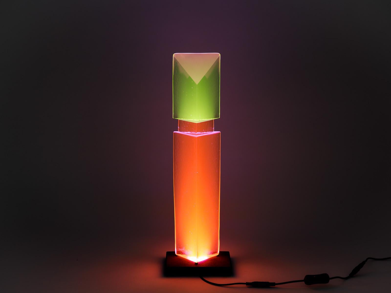 Yves Braun (Born in 1958 in Brussels)

Important and unique fluorescent light glass sculpture.

Unique process in the world of fluorescent glass. The color is revealed with a LED light in the lava stone base.

The colors are very