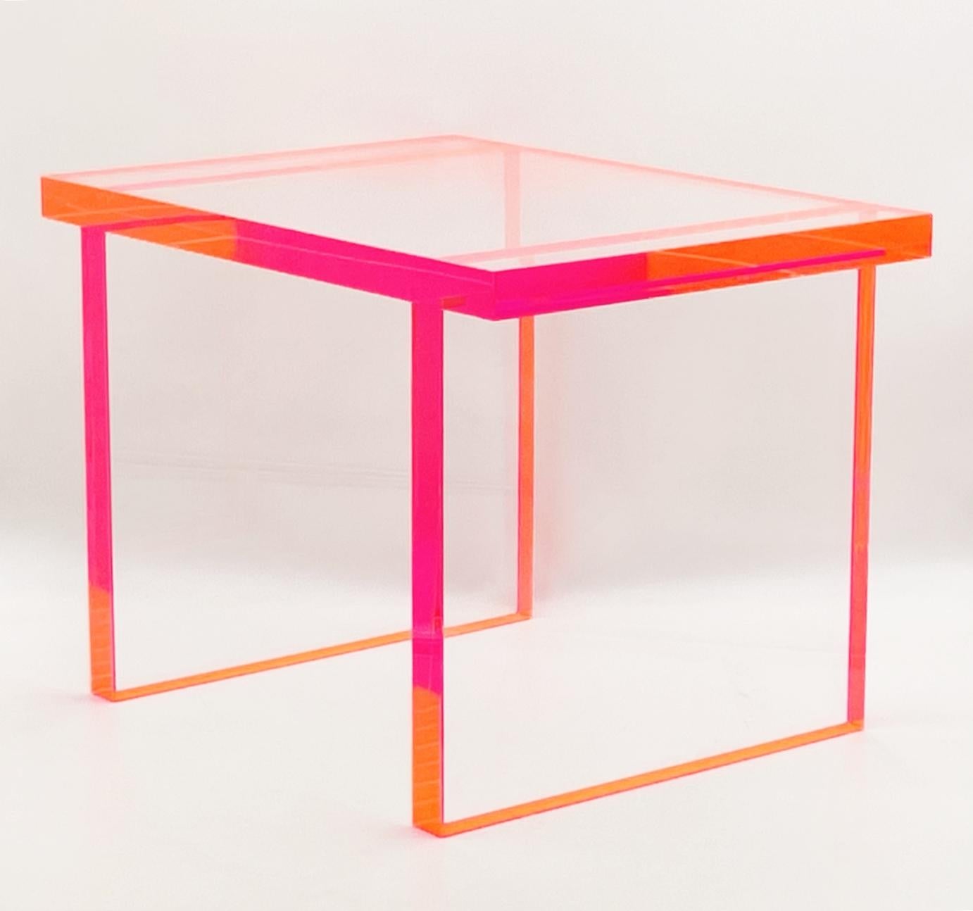 
Introducing the Fluorescent Pink & Clear Lucite Bench by Amparo Calderon Tapia - a stunning addition to any modern furniture collection. Featuring a bold mix of fluorescent pink and clear Lucite, this bench is a true statement piece that will add a