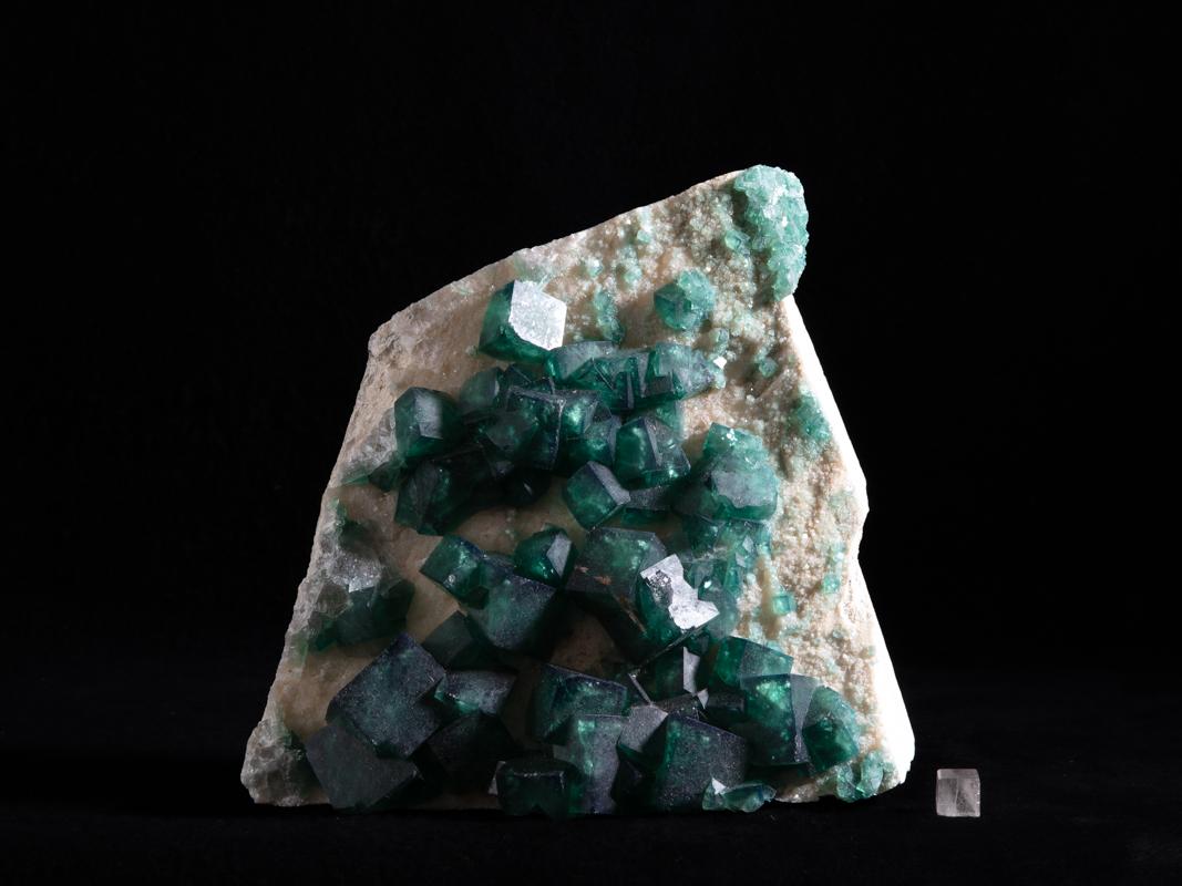 This fluorite specimen is highly fluorescent, bearing a vibrant green fluorescence under both longwave and shortwave UV. Fluorite is a halide mineral comprised of calcium and fluorine,