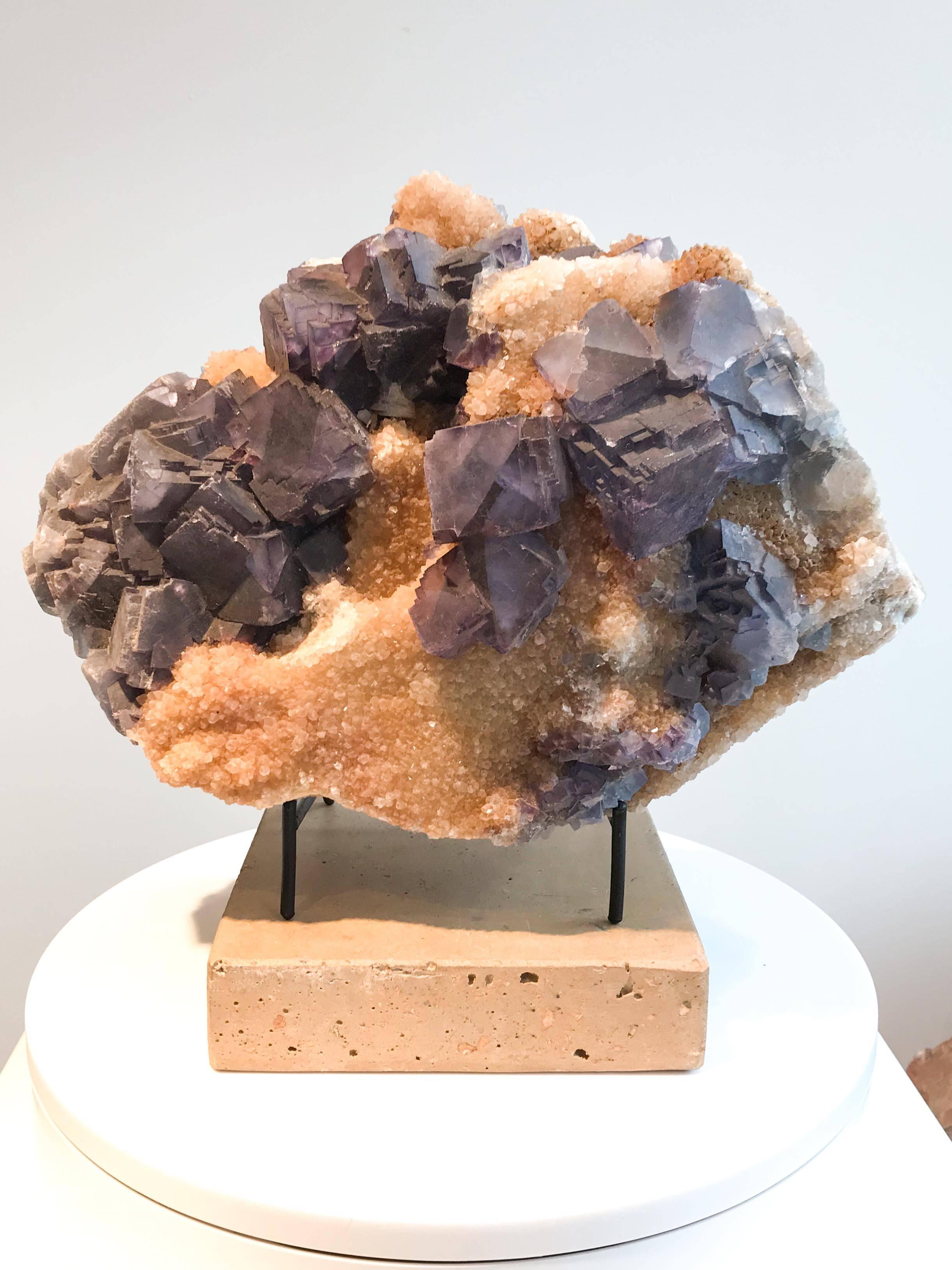 Fluorite on quartz specimen from an Illinois fluorite mine. Quartz is thought to focus and amplify positive information and energies. Includes stand and plinth.