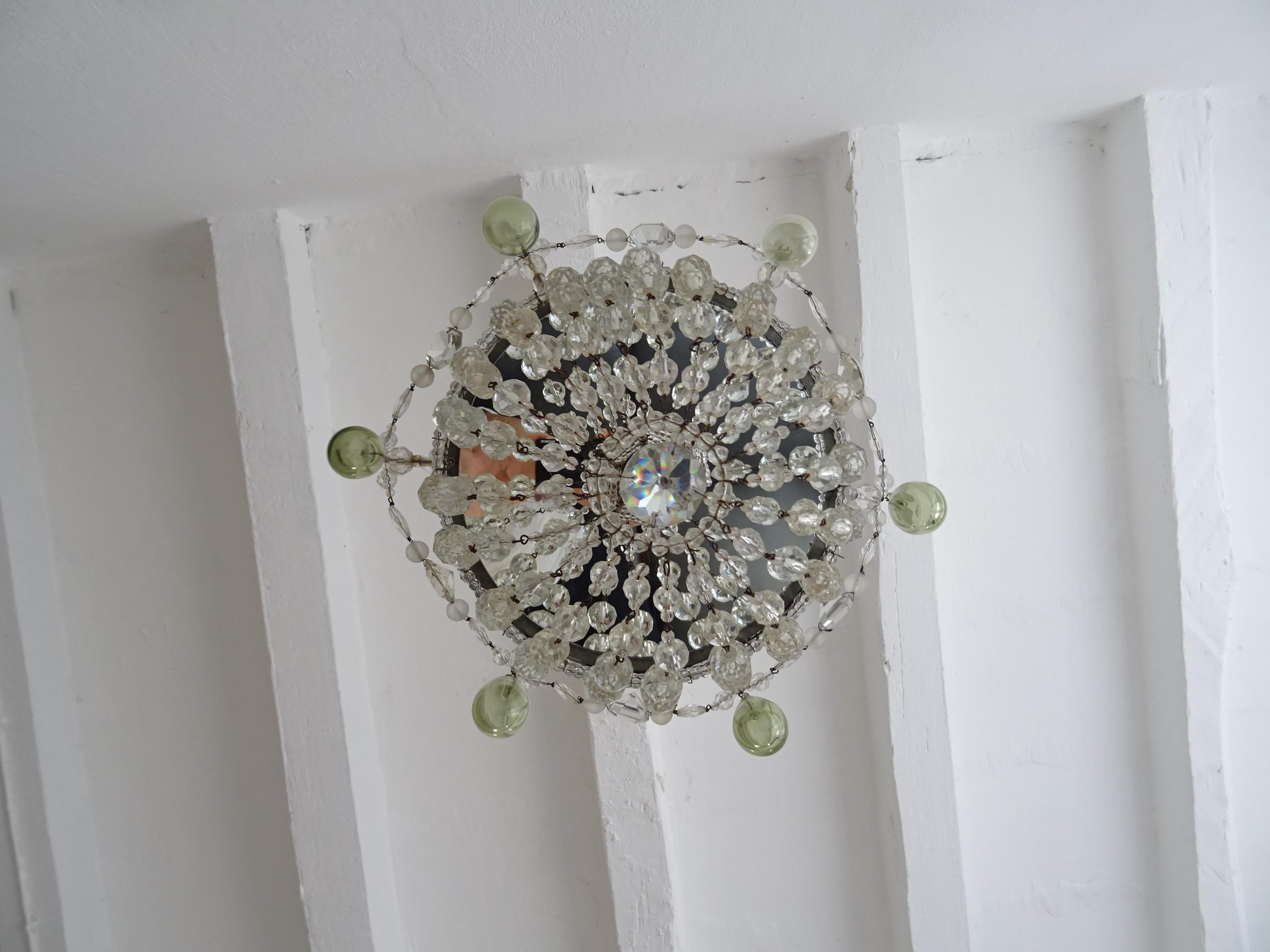 Housing 1 light, sitting under a vintage beaded bulb holder. Will be rewired with a certified US UL socket for the USA and appropriate socket for all other countries and ready to hang. This looks like a crown on top with the swags of vintage