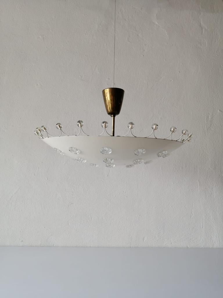White metal ceiling lamp by Emil Stejnar for Rubert Nikoll, 1950s, Austria

Emil Stejnar is an Austrian designer, astrologer and author. In many of his designed subjects you can feel his astrological understanding because of the dimensional
