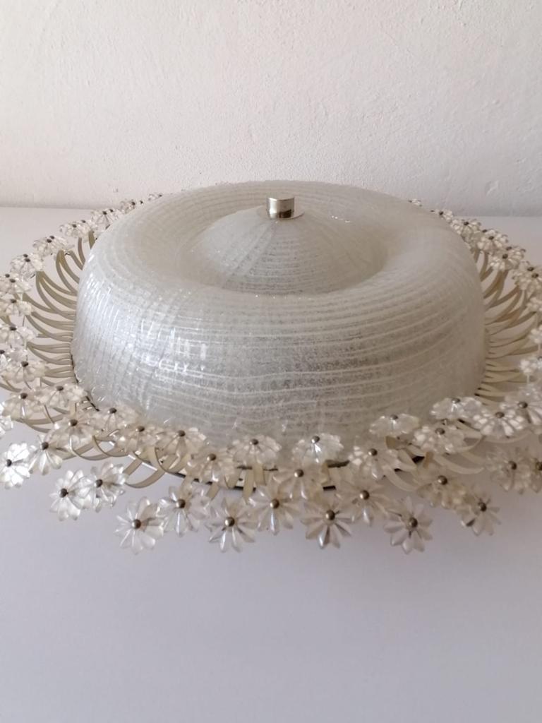 Textured glass flushmount by Emil Stejnar for Rubert Nikoll, 1960s, Austria

Extraordinary round design large ceiling lamp.

Metal base, textured glass dome cover and glass flowers. All glass flowers attached to the base with metal parts.
The