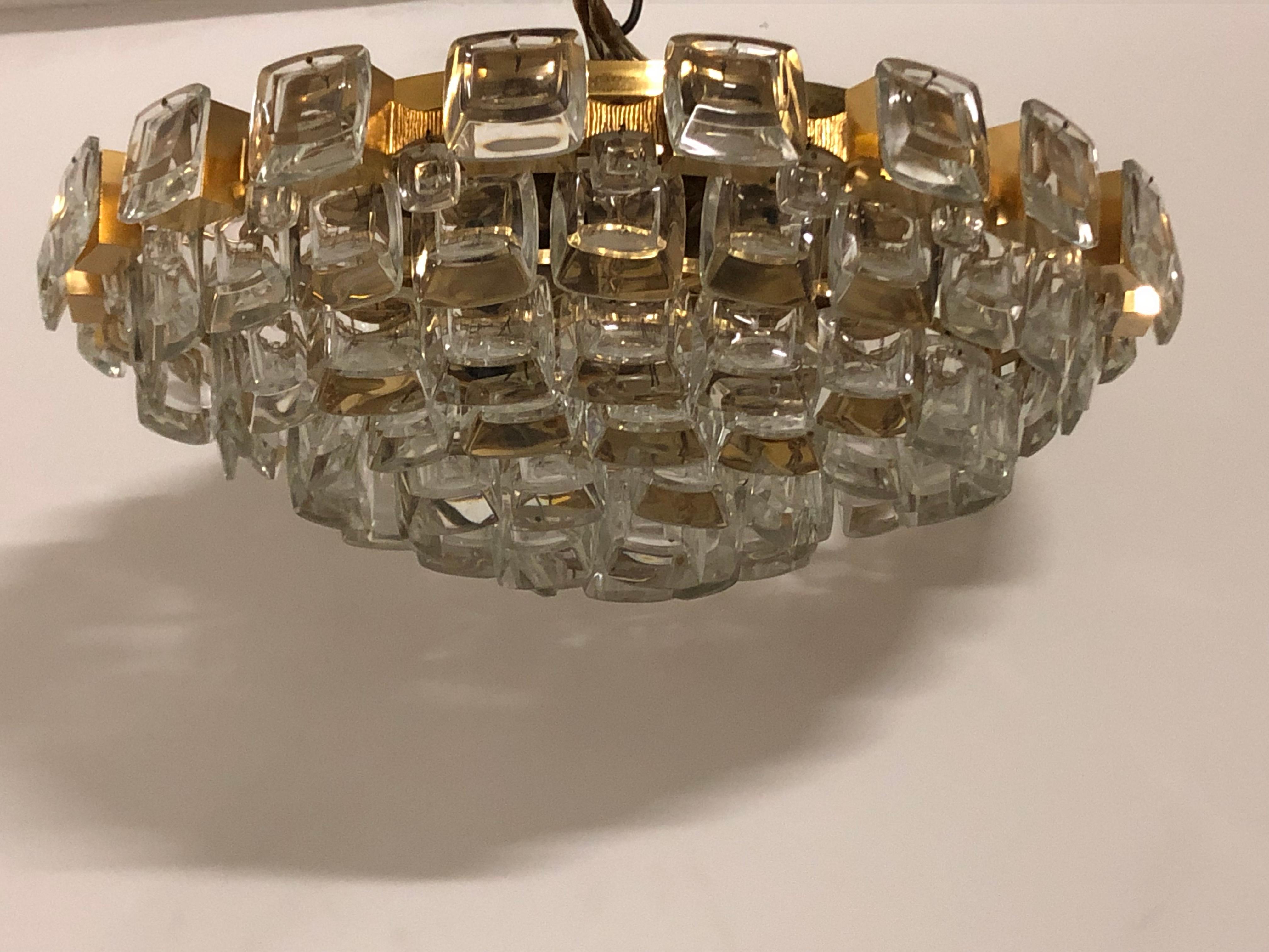 Wonderful midcentury, gilt brass flush mount with square lens glasses.
A high - quality light fixture in the Hollywood Regency style made by Palwa, Germany, circa 1970s.
The chandelier needs 5 x e14 (Edison) standard screw bulbs to illuminate.

 