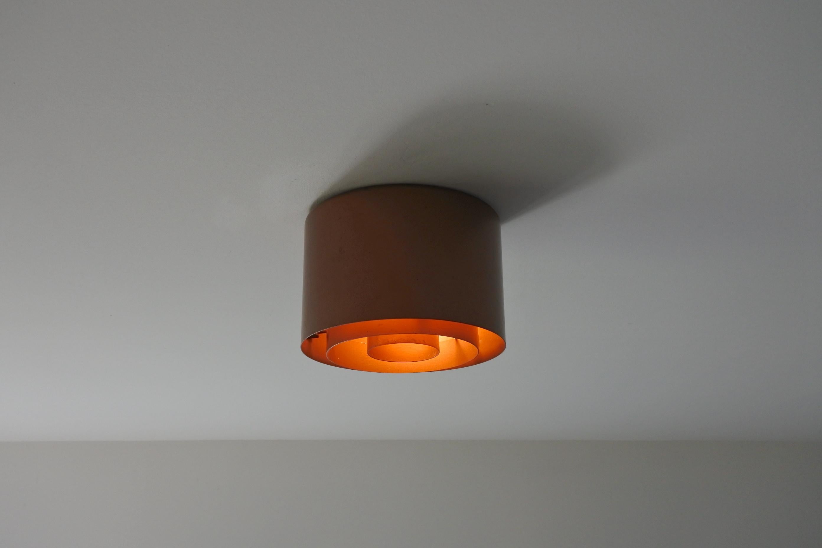One flush mount ceiling light model H2-28.
Designed and manufactured by Idman Oy in Finland in the 1960s. 
Copper lacquered metal. 
The light takes one E27 bulb.
Manufacturer's stamp.
Two available.
Outstanding ceiling lamp.

Original