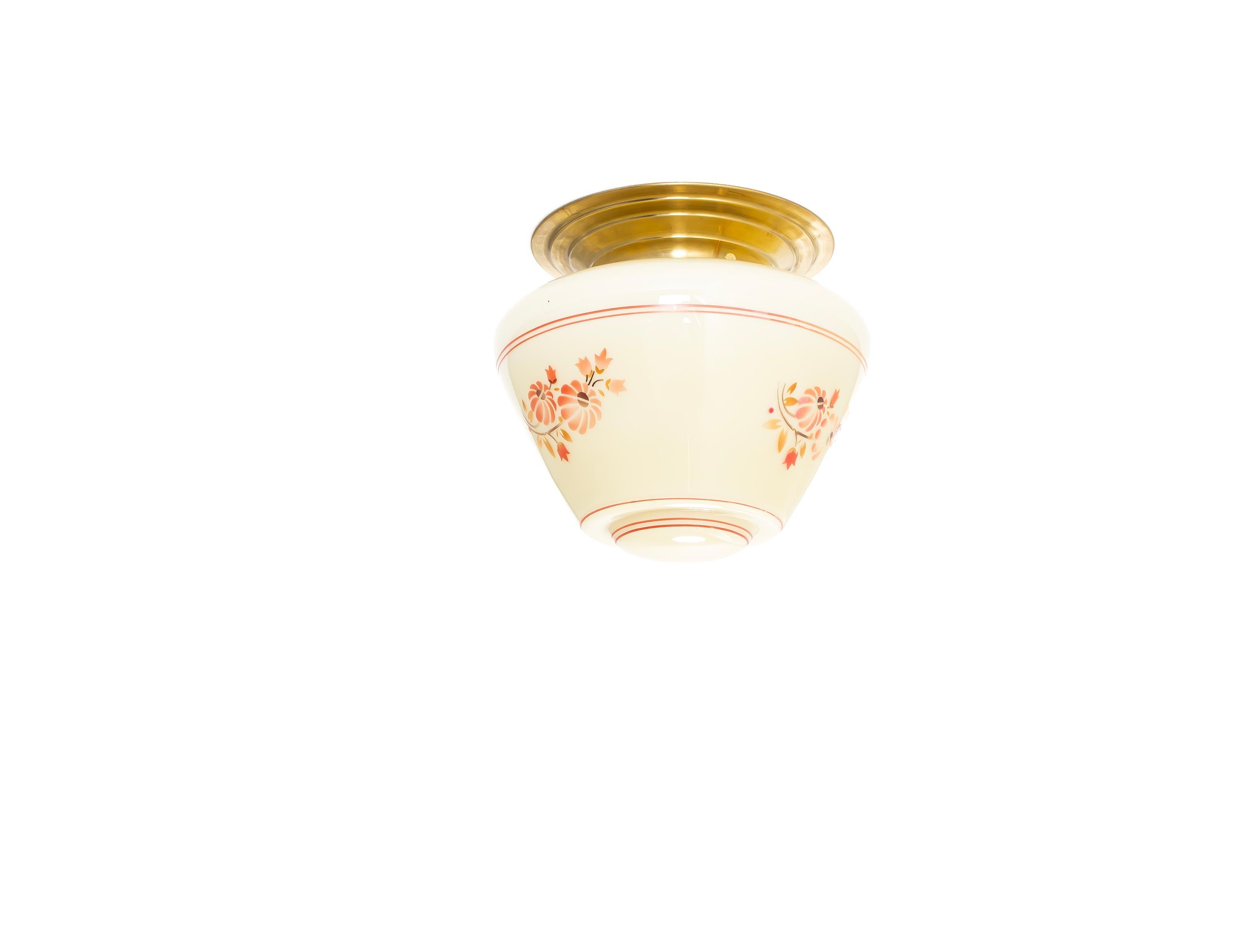 Wonderful ceiling light with hand-painted glass shade and brass metal base. Designed and made in Norway from circa 1950s first half. The lamp is fully working and in good vintage condition. It is fitted with one E27 bulb holder (works in the US) and