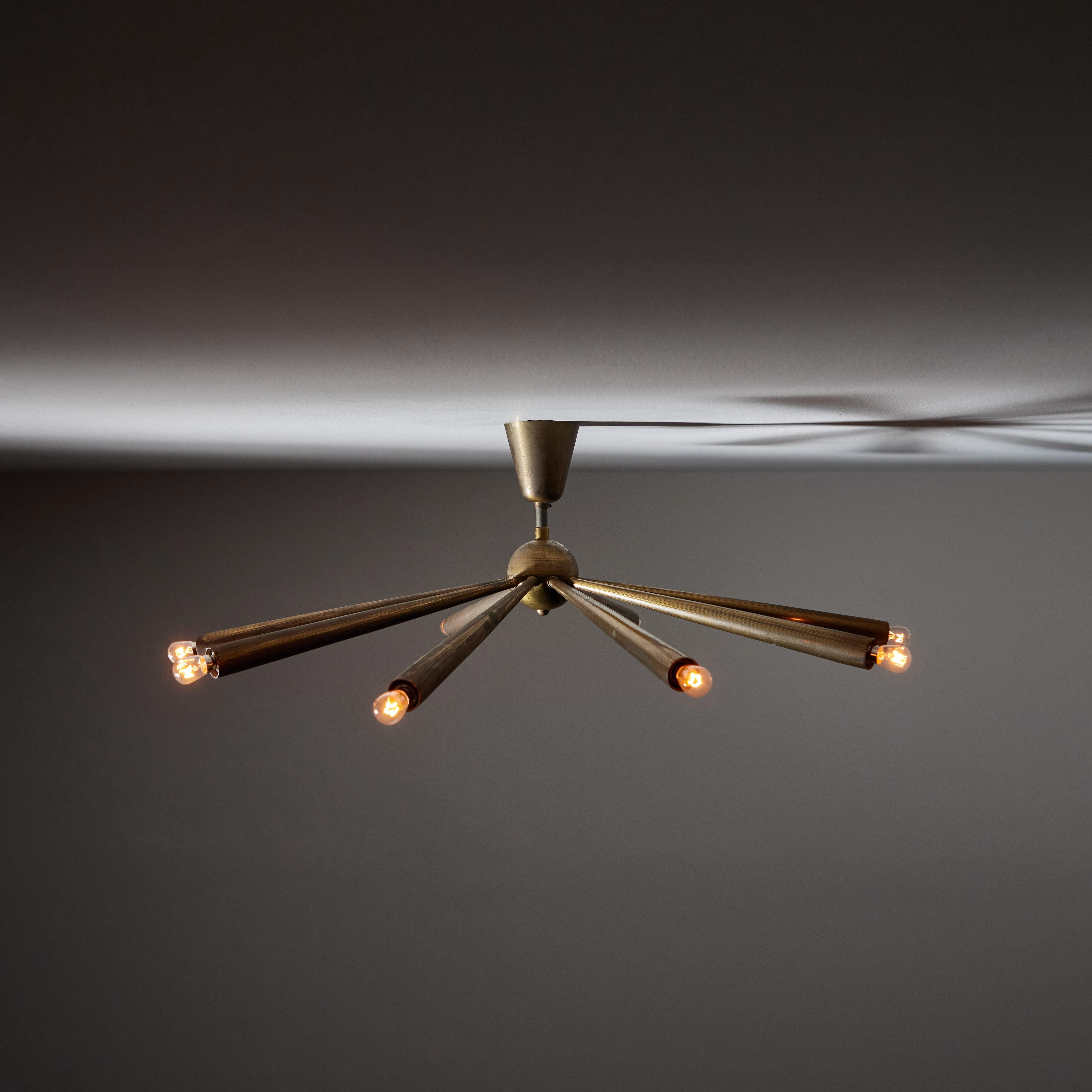 Flush mount ceiling light by Angelo Lelli for Arredoluce. Designed and manufactured in Italy, circa 1950's. Brass. Original canopy. Rewired for U.S. standards. Recommended lamping 120v 10 Qty E14 Sockets 15w Clear Bulb. Lightbulbs not included.