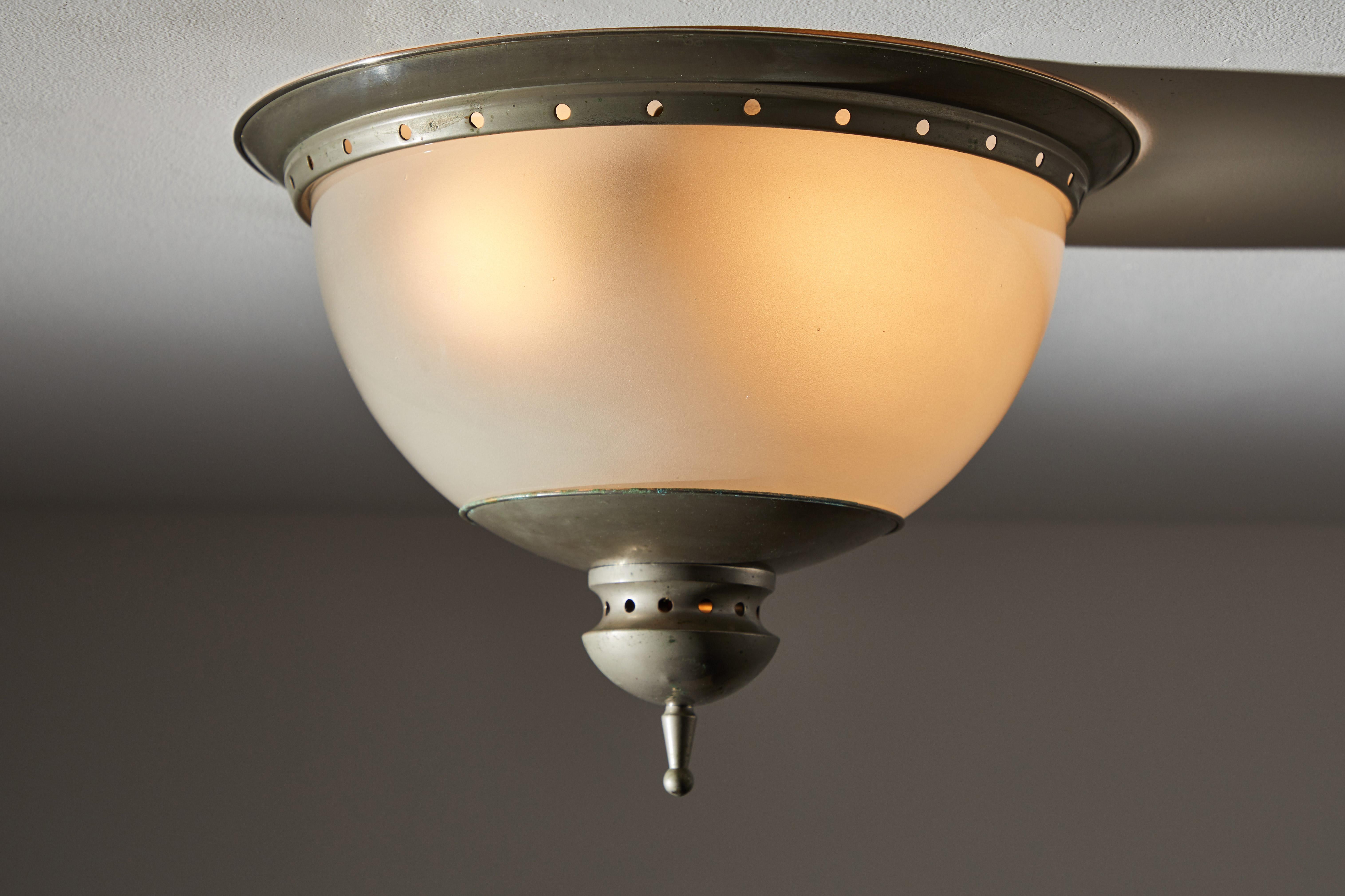 Flush mount ceiling light in the style of Caccia Dominioni for Azucena. Designed and manufactured in Italy, circa 1950s. Pewter plated brass, opaline glass. Rewired for U.S. Junction boxes. Takes two E27 75w maximum bulbs. Bulbs provided as a