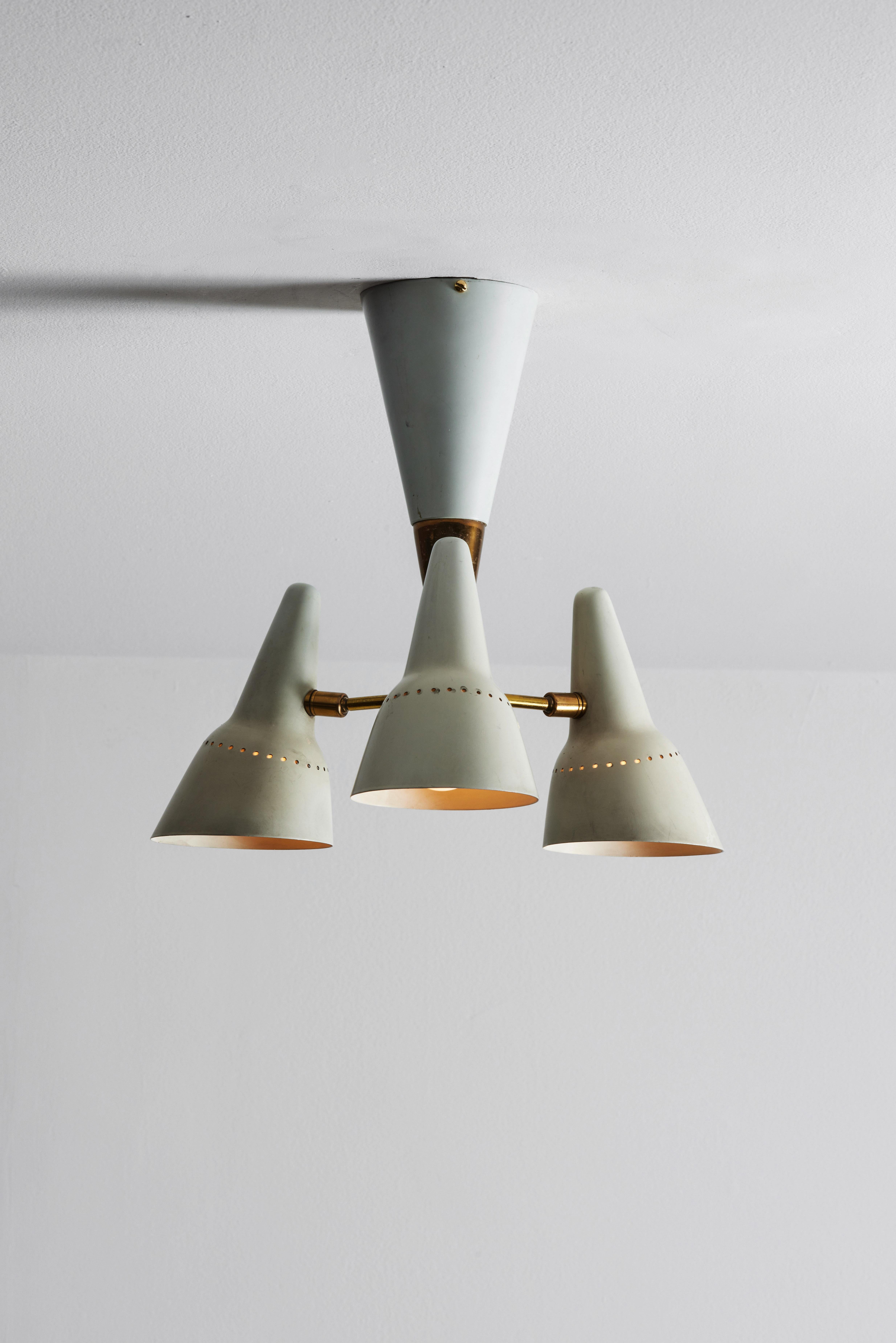 Flushmount ceiling light by Lumen. Manufactured in Italy, circa 1950s. Enameled metal, brass. Rewired for U.S. Standards. Shades articulate to various positions. We recommend three E26 40w maximum bulbs. Bulbs provided as a one time courtesy.
