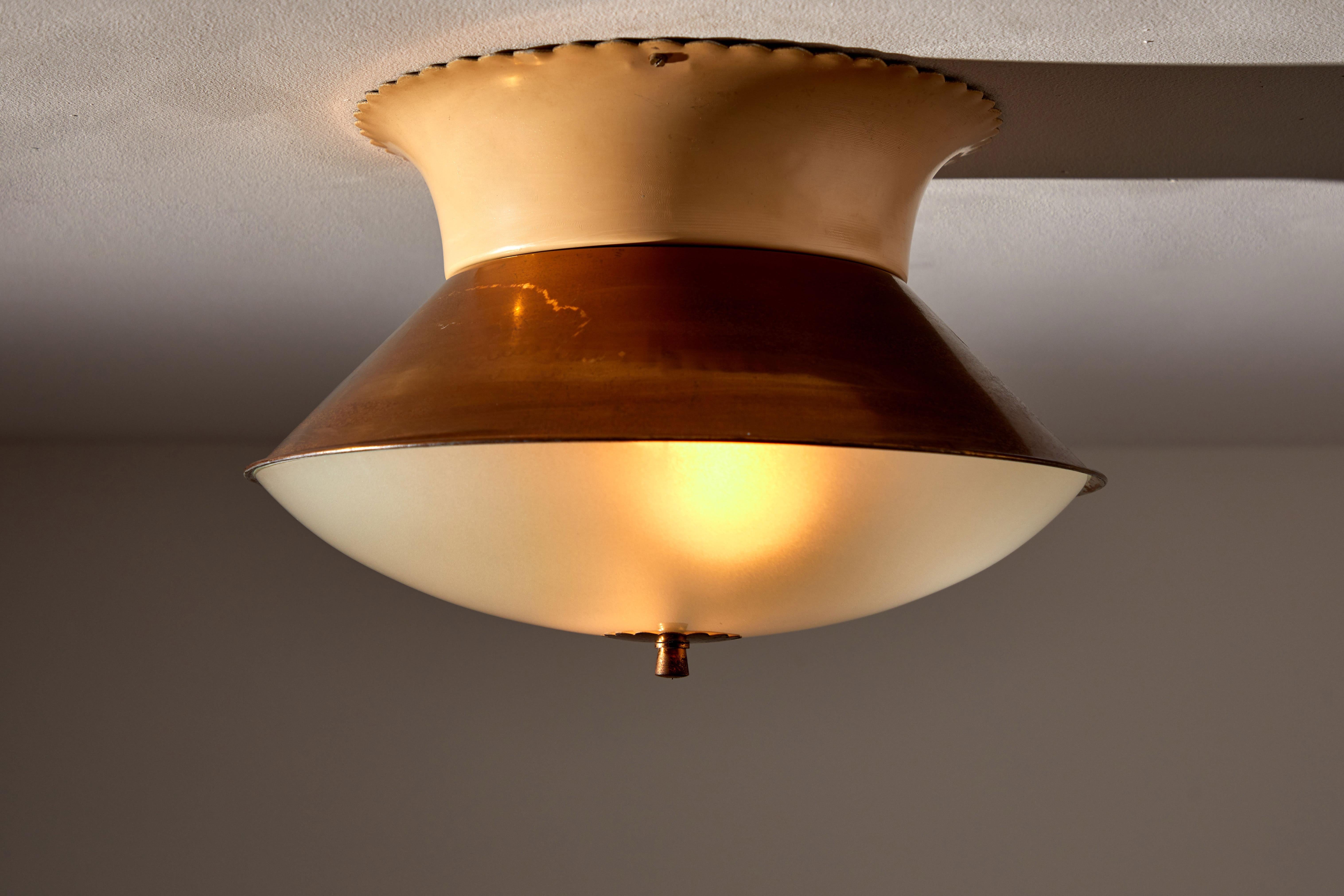 Flush mount ceiling light by Lumi. Manufactured in Italy circa 1950s. Opaline glass diffuser, brass armature and finial, enameled metal base. Rewired for US junction boxes. Takes two E27 25w maximum bulbs. Bulbs included as a one time courtesy.