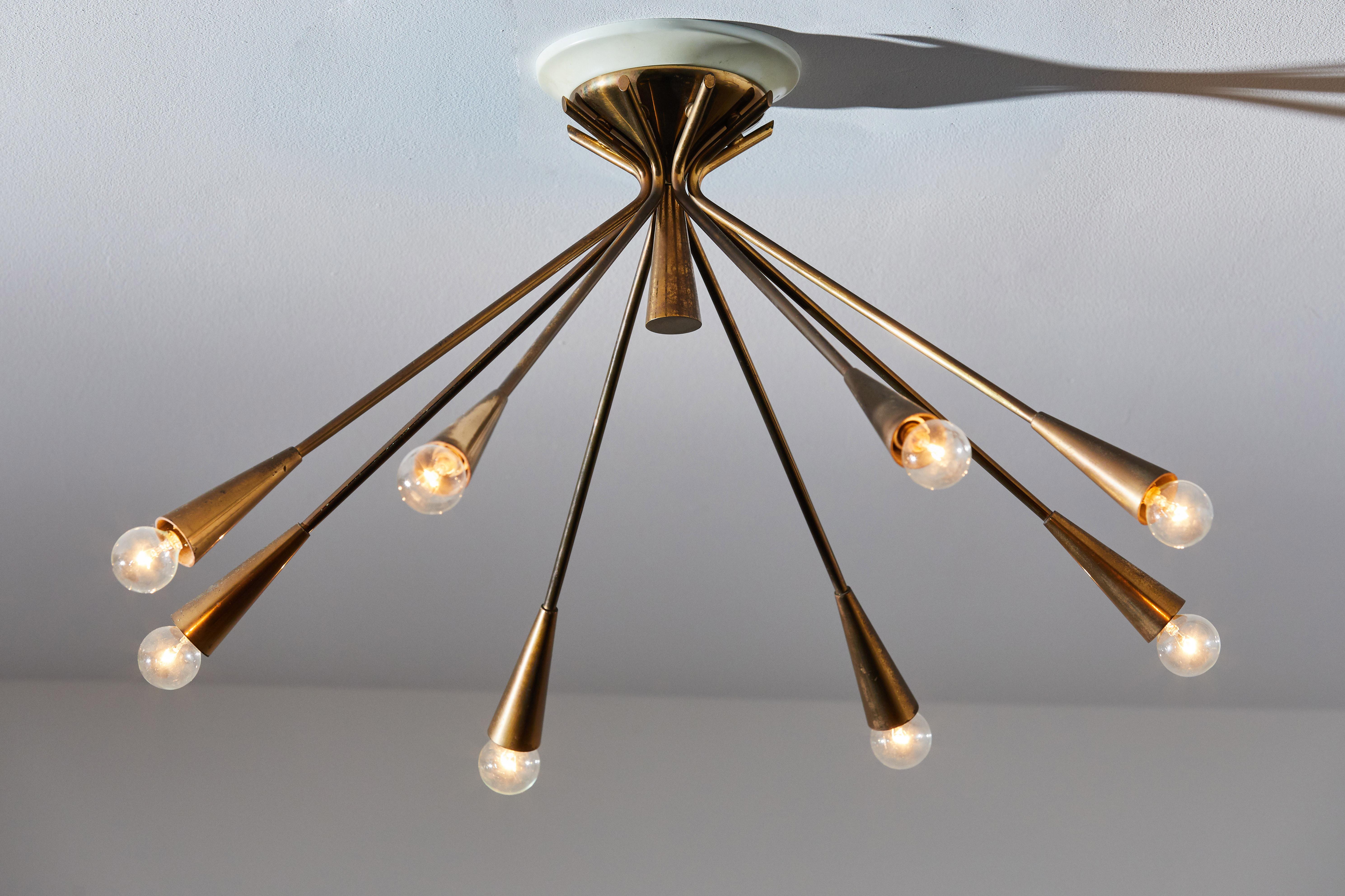 Flush mount ceiling light by Oscar Torlasco for Lumi. Designed and manufactured in Italy, circa 1950s. Brass, enameled metal. Rewired for U.S. junction boxes. Retains original manufacturer's label. Takes eight E27 European candelabra 25w maximum