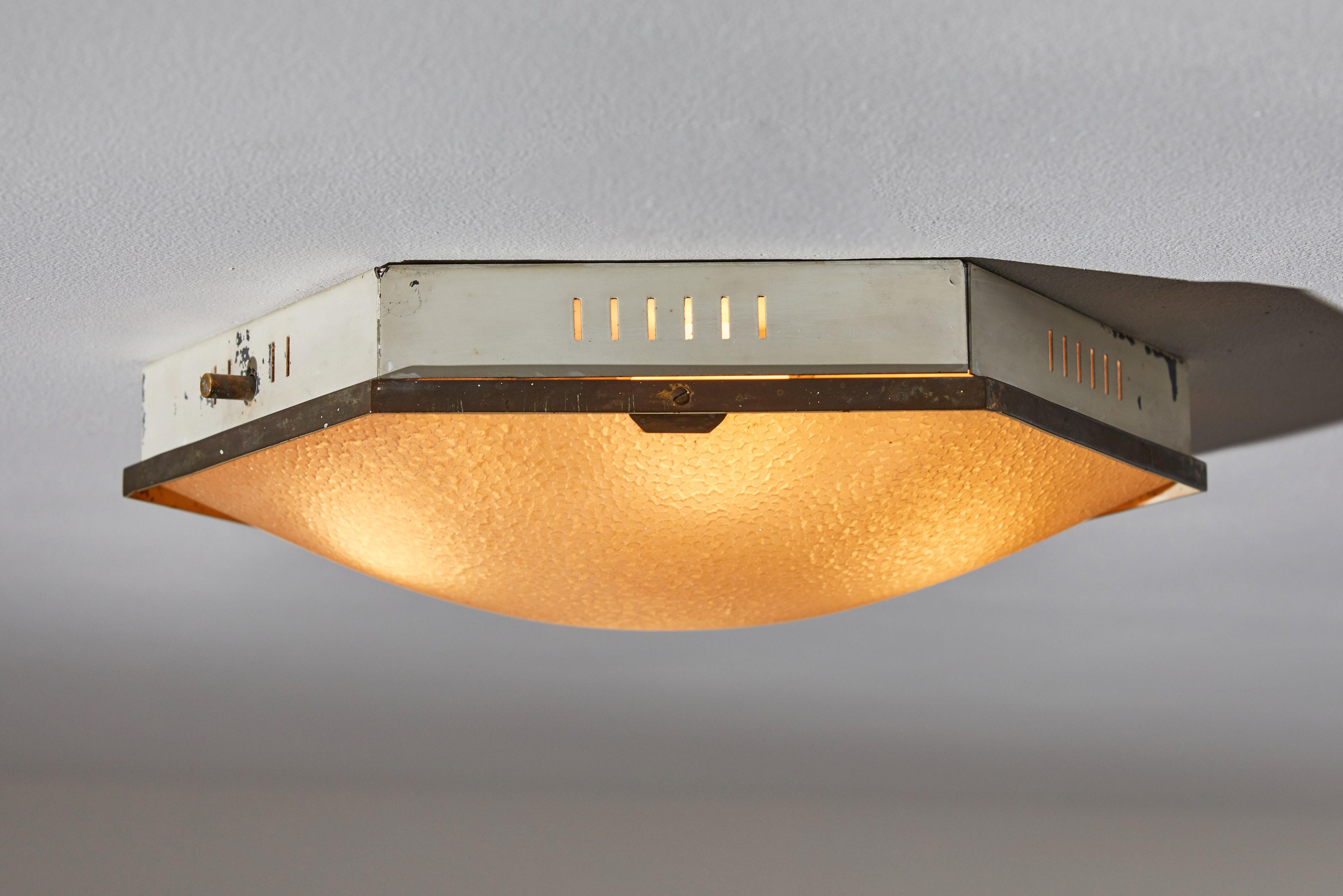 Flush mount ceiling Light by Stilnovo. Manufactured in Italy, circa 1950s. Enameled metal, bras textured glass. Rewired for U.S. junction boxes. Retains part of manufacturer's label. Bulbs provided as a onetime courtesy.