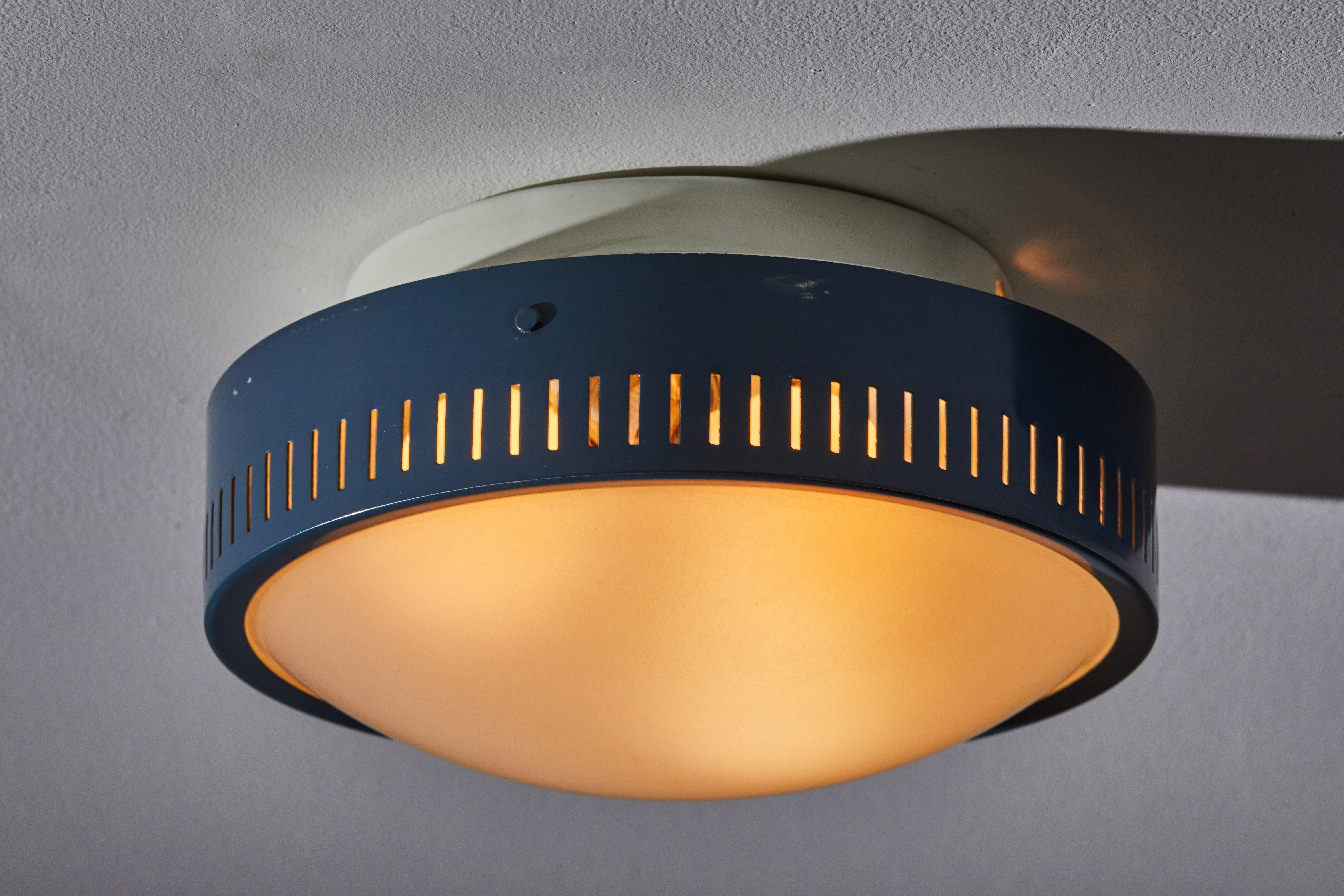 Flush mount ceiling light by Stilnovo. Manufactured in Italy, circa 1950s. Original enameled metal, opaline glass diffuser. Rewired for U.S. junction boxes. Takes three E27 60W maximum bulbs. Bulbs provided as a onetime courtesy.