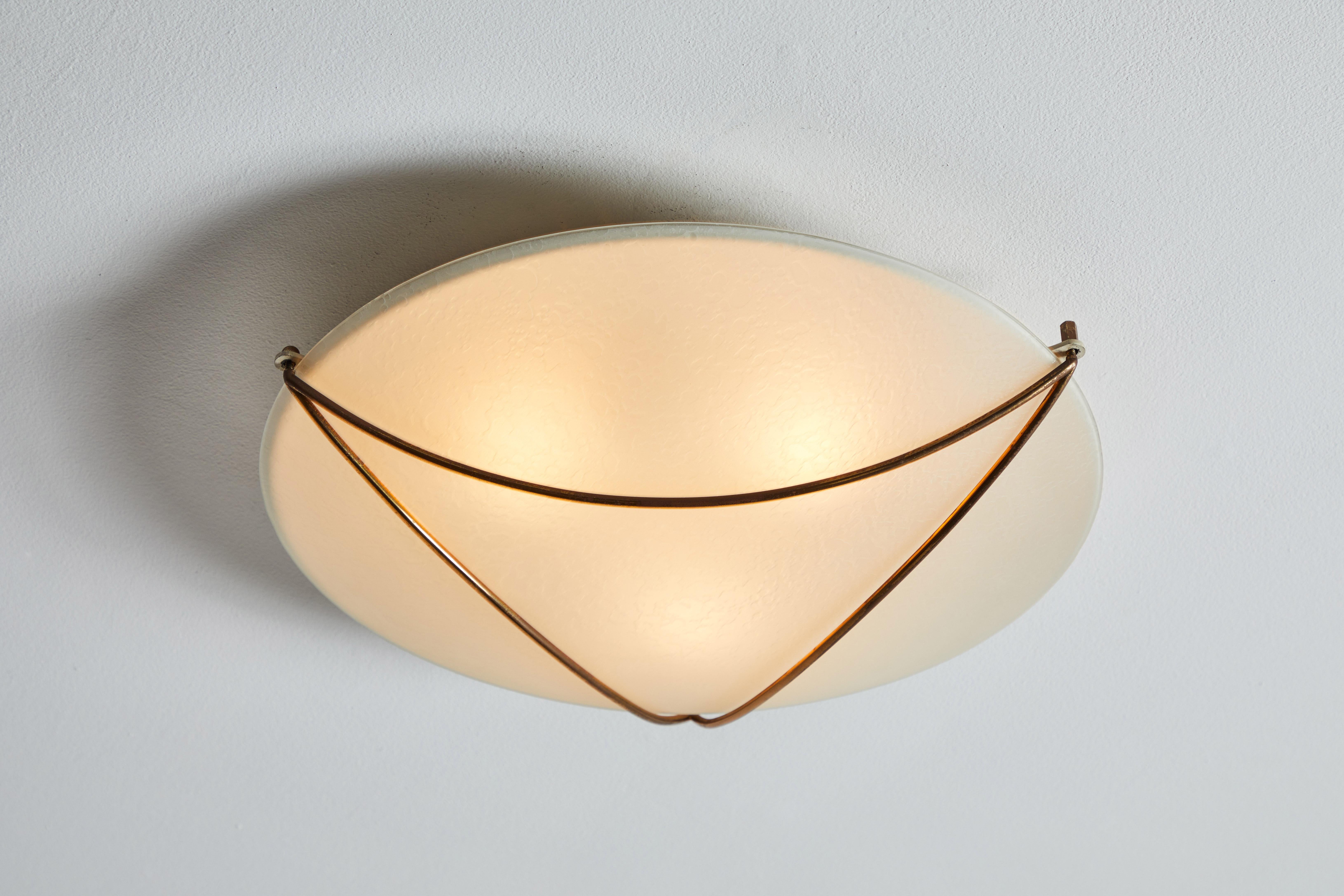 Flush mount ceiling light by Stilnovo. Manufactured in Italy, circa 1950s. Opaline glass and brass. Rewired for U.S. standards. We recommend three E26 25w maximum bulbs. Bulbs provided as a one time courtesy.