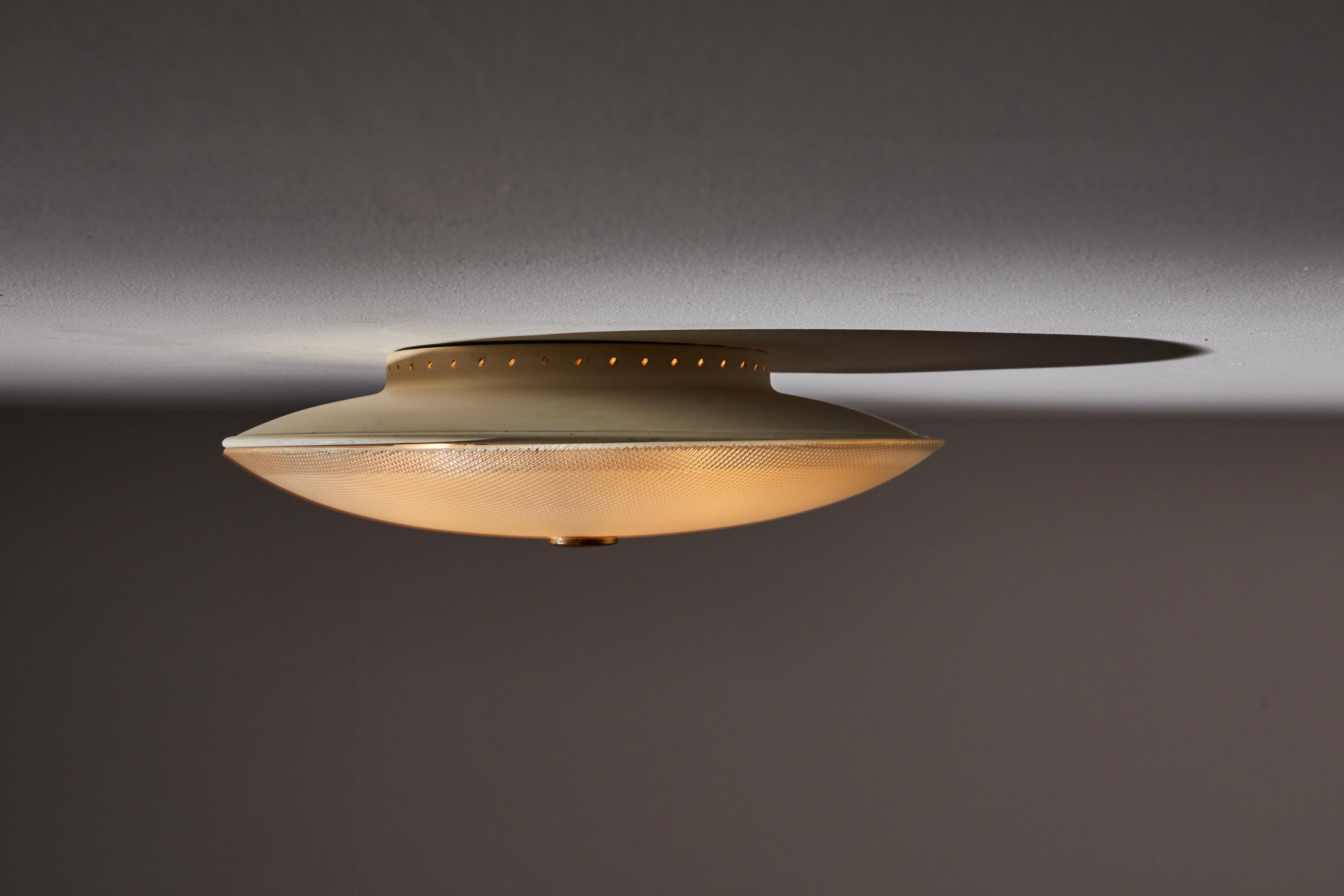 Flush mount ceiling light by Stilnovo. Manufactured in Italy, circa 1960s. Brass, enameled aluminum, Holophane glass. Retains original manufacturer's label. Rewired for US junction boxes. Takes three E27 40w maximum bulbs. Bulbs provided as a one