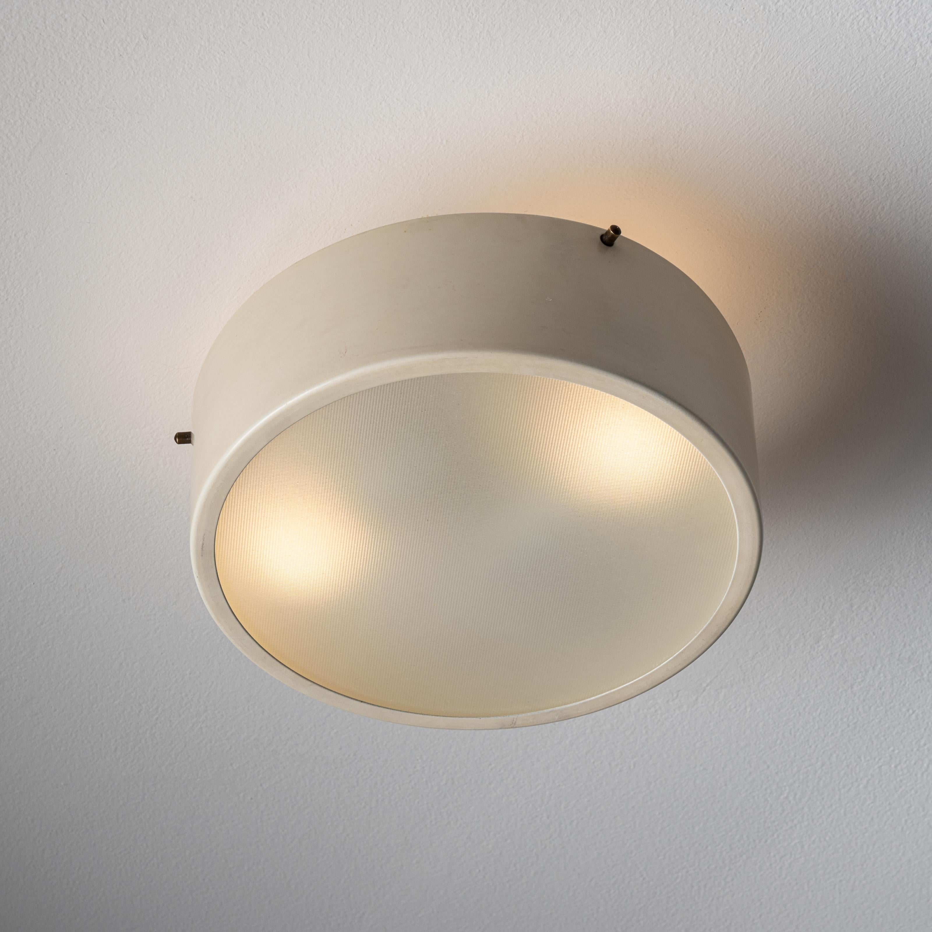 Flush mount ceiling light by Tito Agnoli. Designed and manufactured in Italy, circa 1960's. Metal, glass. Wired for U.S, standards. We recommend:Lamping: 120v 2 Qty EU E14 Socket 40w Incandescent Frosted Globe.