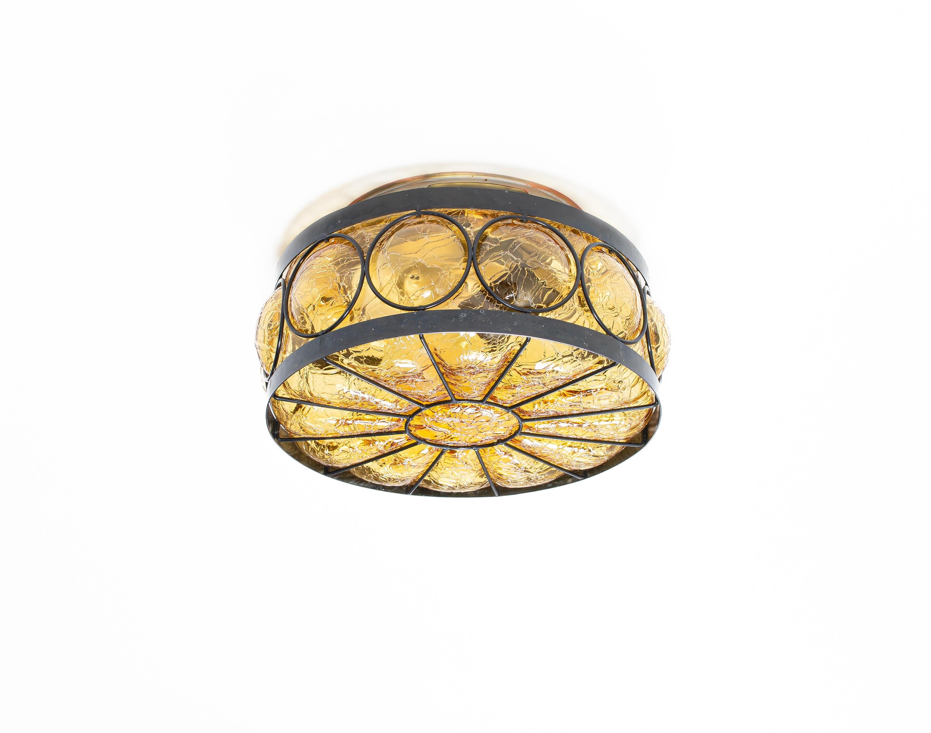 Wonderful flush mount ceiling lamp with shade in blown glass and frame in painted steel. Designed and made in Norway from circa 1950s first half. The light is fully working and in good vintage condition. The lamp is fitted with one E27 bulb holder