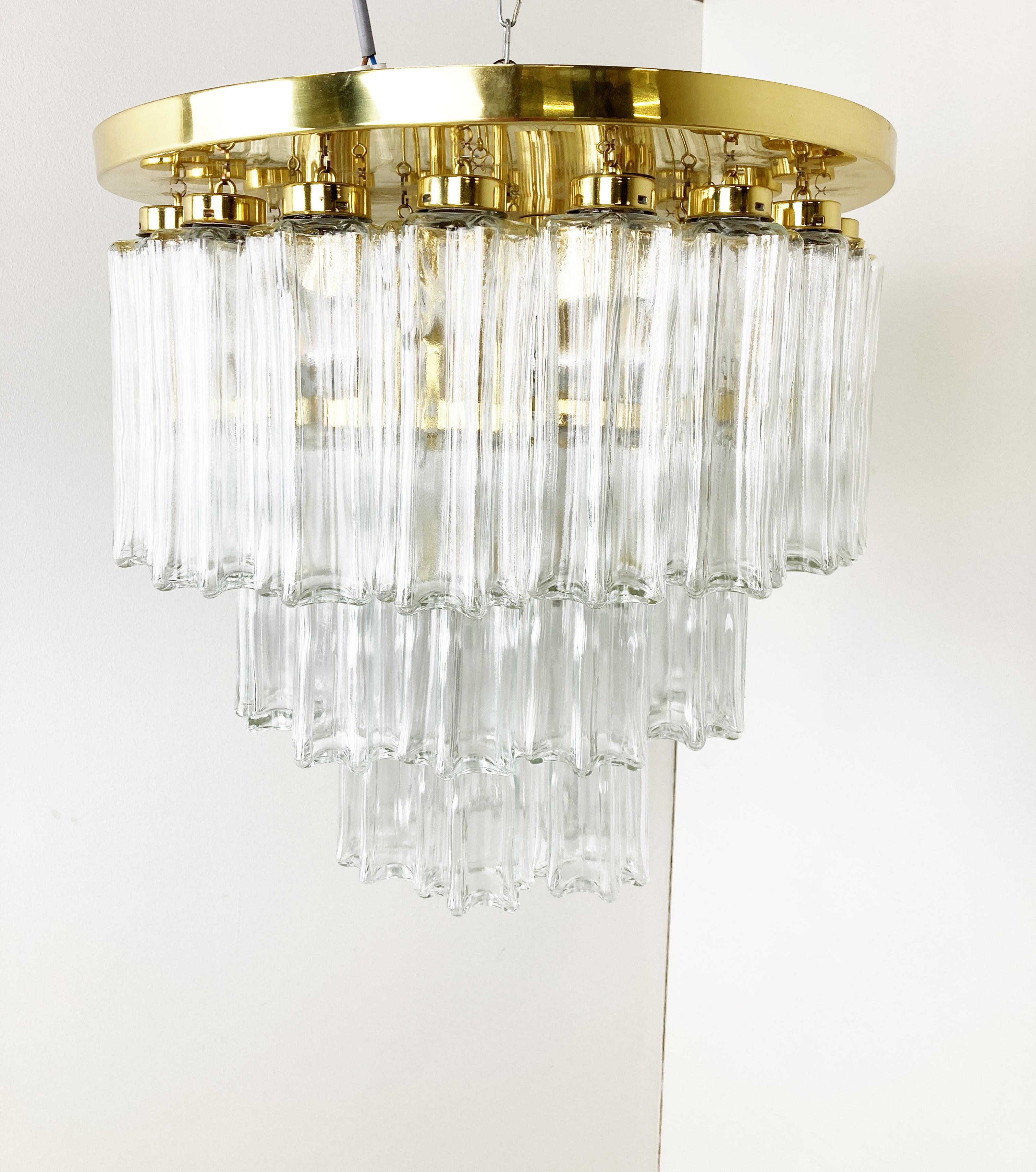 Striking flush mount chandelier by Glashutte Limburg with hand made glass pendants and a brass frame.

The chandelier emits a stunning light.

Tested and ready to use with regular E27 light bulbs

1970s - Germany

Dimensions:
Height: