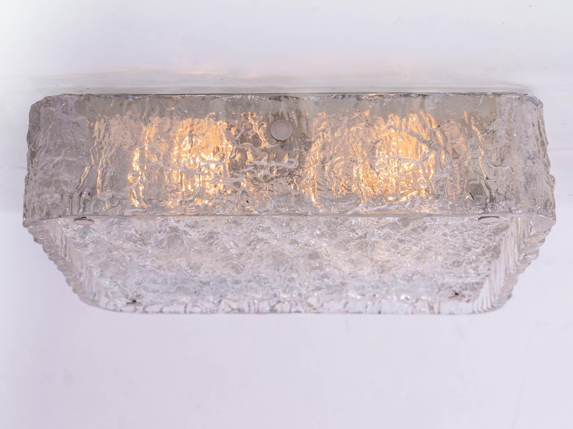 Elegant large two part rectangular-shaped flush mount ceiling light with one ring outside and a flat disc made of heavy textured clear iced glass on a white laquered metal frame with chromed nickel finals. Manufactured by Kaiser Lighting, Germany in
