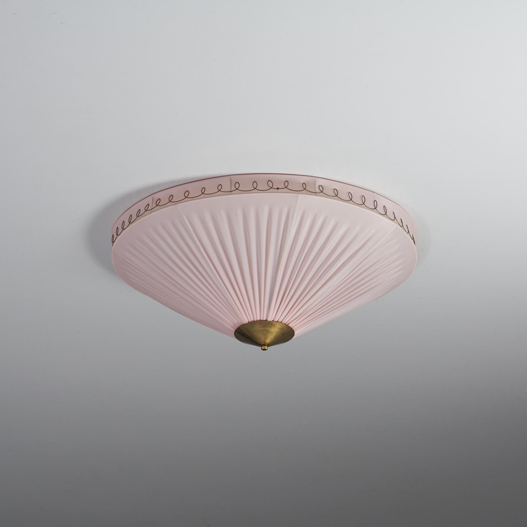 Finnish flush mount, 1950s. Plastic and brass details. Good vintage condition, patina consistent with age and use. 