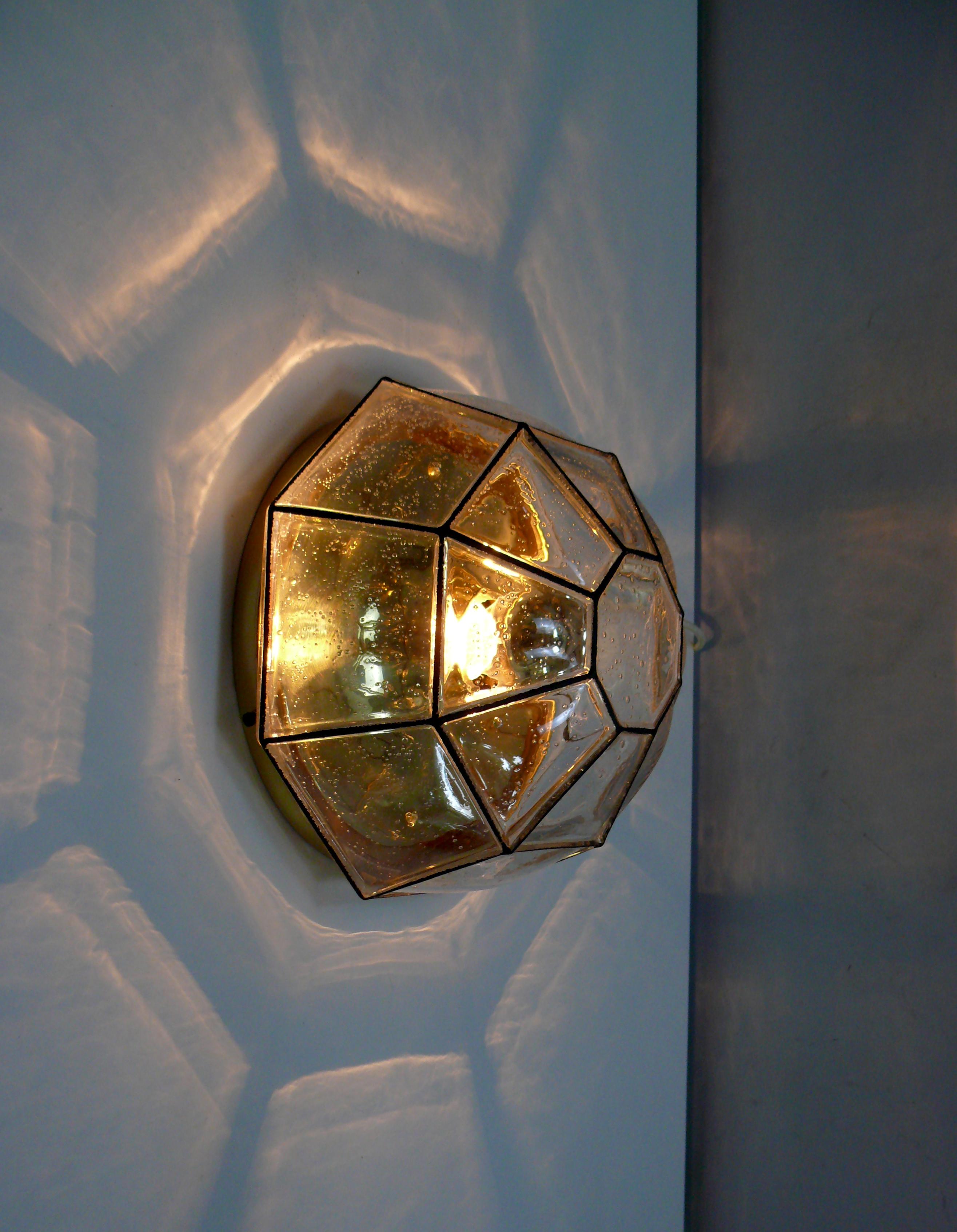 Octagonal ceiling light from the 1970s by the traditional company Glash�ütte Limburg in the style of old leaded glass: The glass dome is made from a single piece, but the glass has a black stripe along the edges, separating the resulting glass