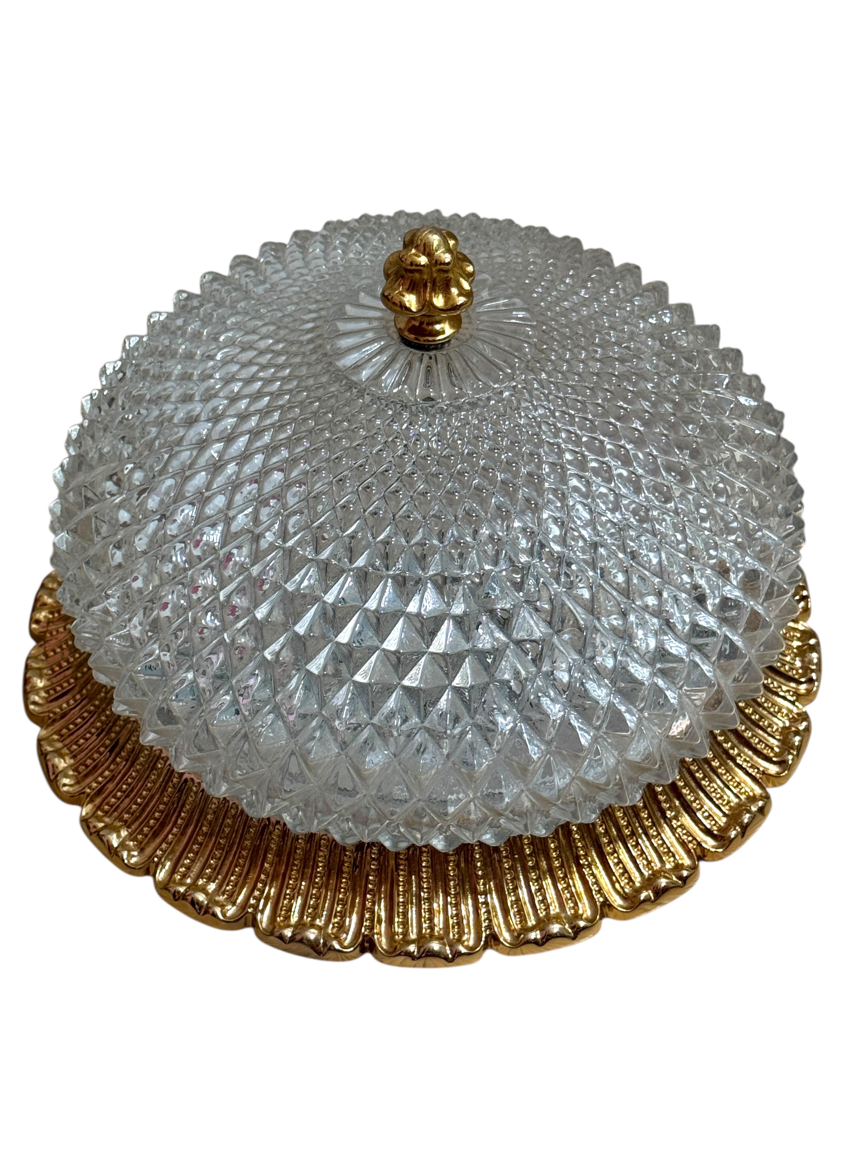 Beautiful Flush Mount Ceiling Light with crystal glass and metal edge gold plated oval 1960s.
Manufactured by Glashütte Limburg in an elegant design. Marked with the original label.
A real Design classics, high-quality, thick crystal glass with