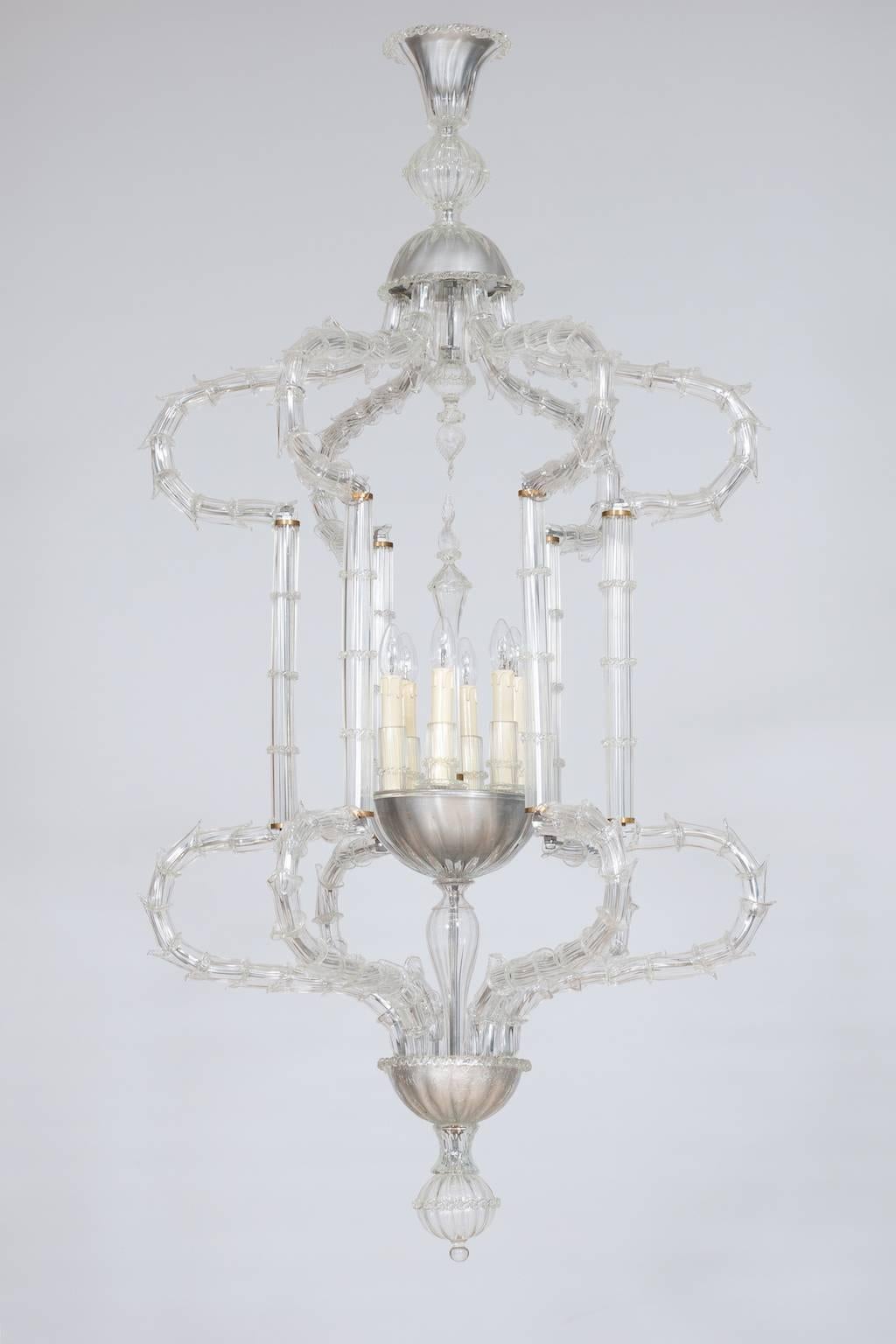 Elegant flushmount in blown Murano glass clear color, Giovanni Dalla Fina 1980s.
This is a finest flush mounts in Ca' Rezzonico style, composed by a series of Murano glass elements allocated along an elegant framework that in the end generates the