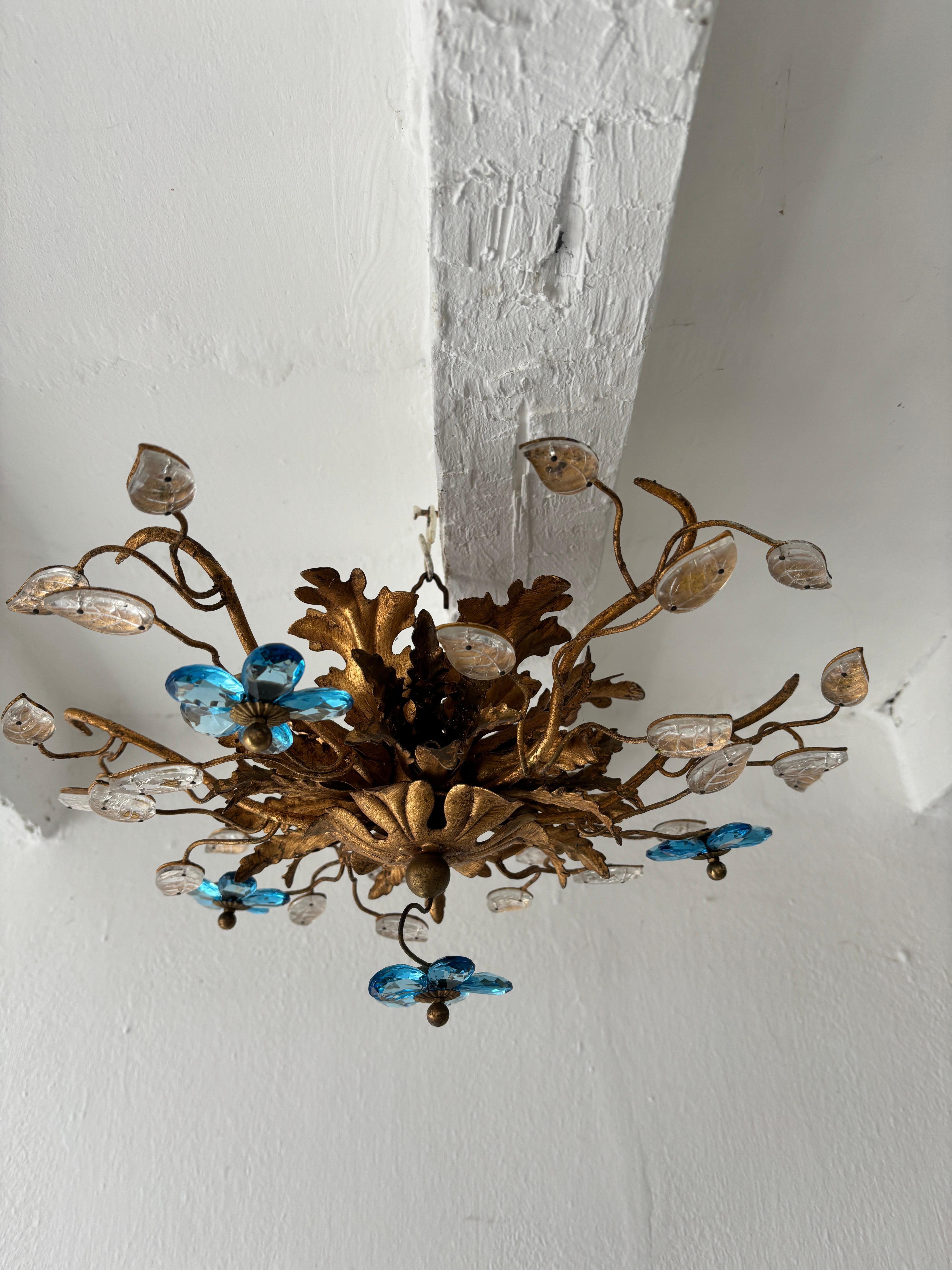 Housing 6 lights. Will be newly rewired free of charge with certified UL US sockets for the USA and appropriate sockets for all other countries and ready to hang. Gold tole with perfect patina.  Crystal prism flowers in blue. Signed Bagues. Free