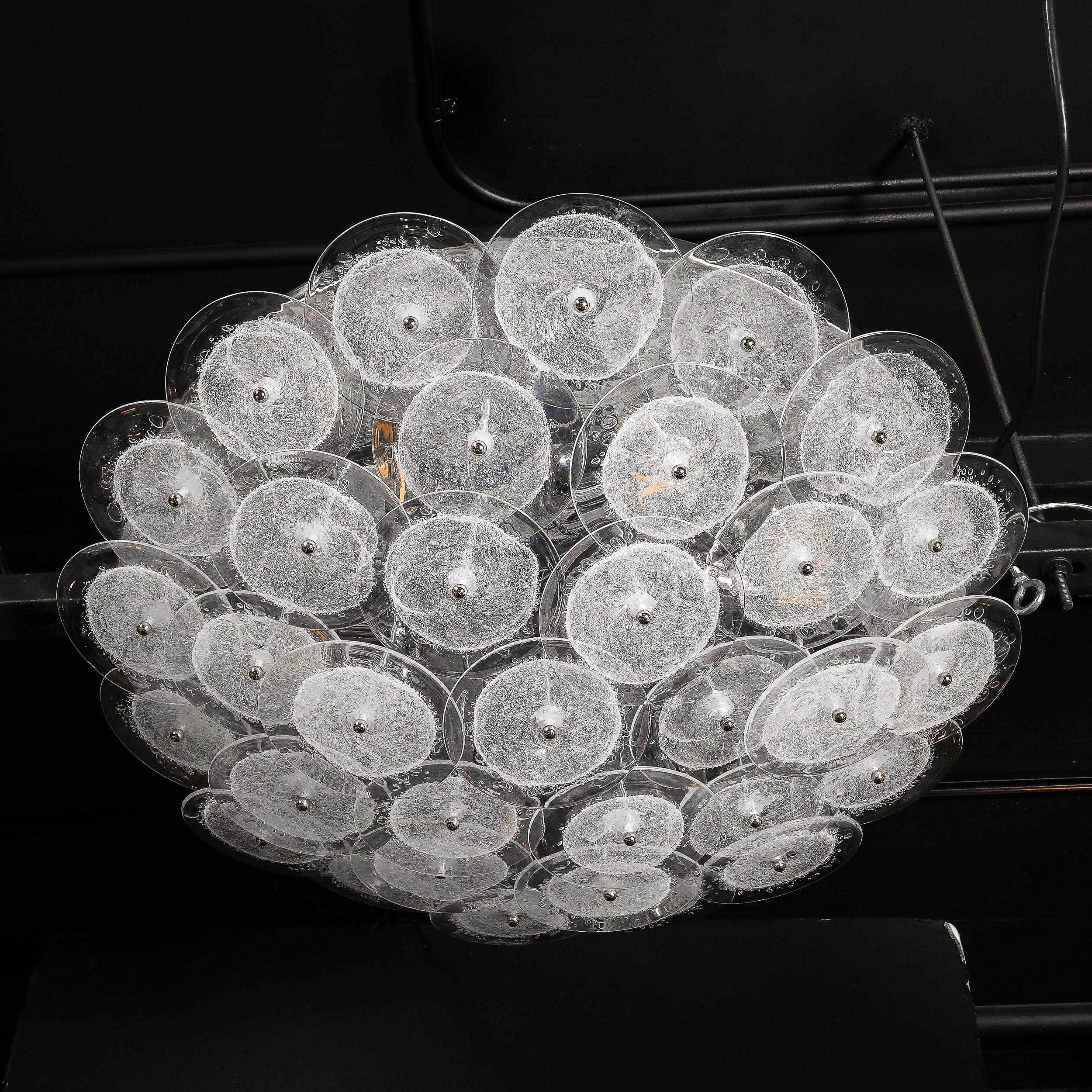 Flush mount chandelier with handblown Murano clear glass discs in the Manner of Vistosi. This flush mount chandelier consists of an array of numerous, individually attached handblown Murano clear glass discs that each incorporate a central bubbled
