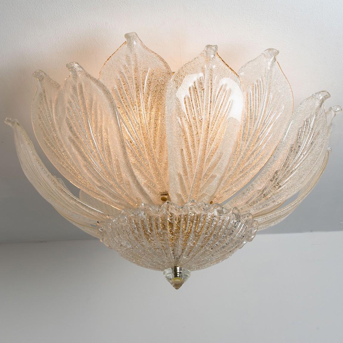 Onee elegant hand blown Murano glass flush mount of Barovier & Toso. Made in Italy, Europe, around 1970. The light fixture consists of 16 blown Murano glass leaves. Mounted on a brass frame. The leaves refract light beautifully. The flush mount