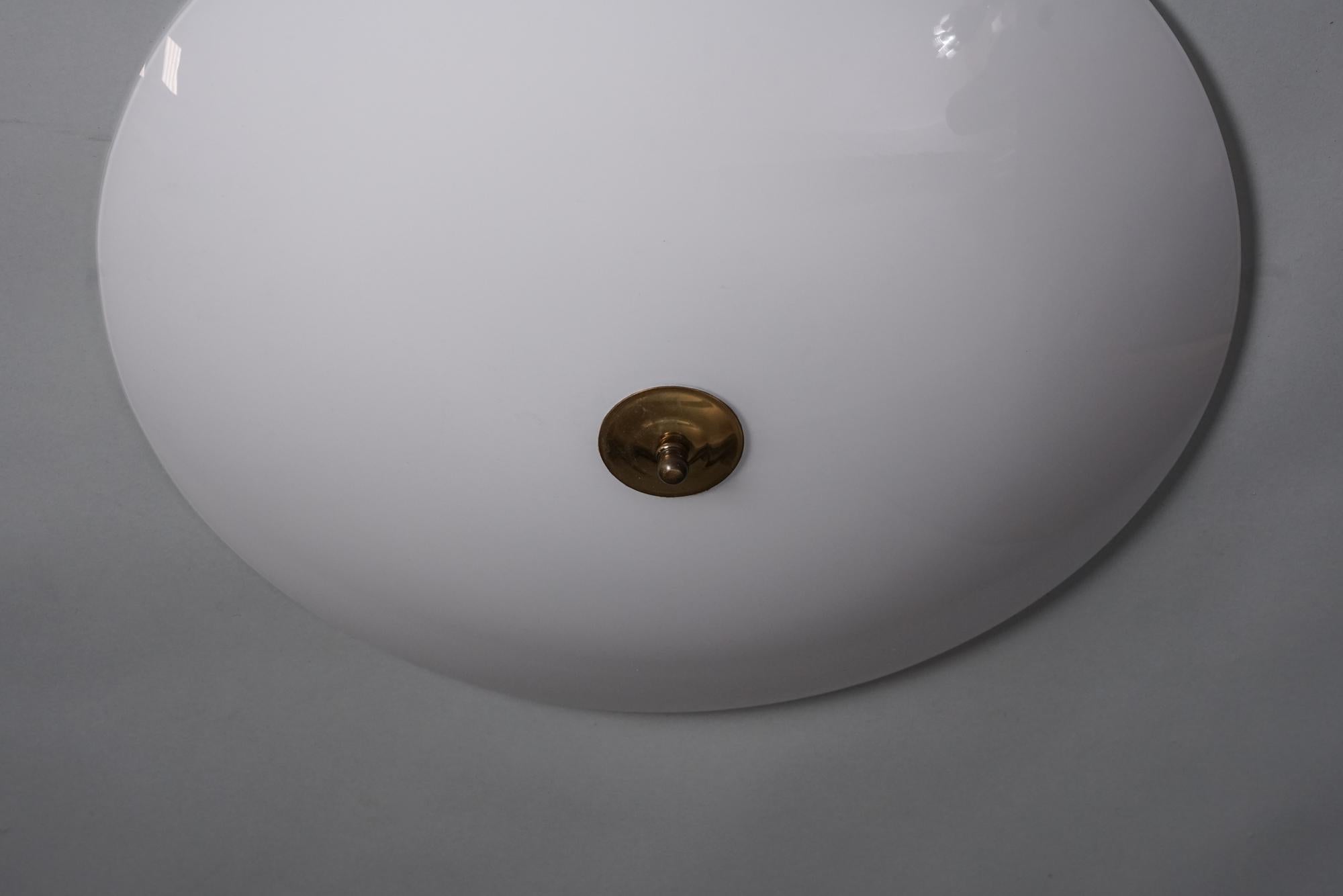 Flush Mount, manufactured by Orno Oy, 1960s. Milk glass shade, brass details. Marked. Good vintage condition, minor patina consistent with age and use. 