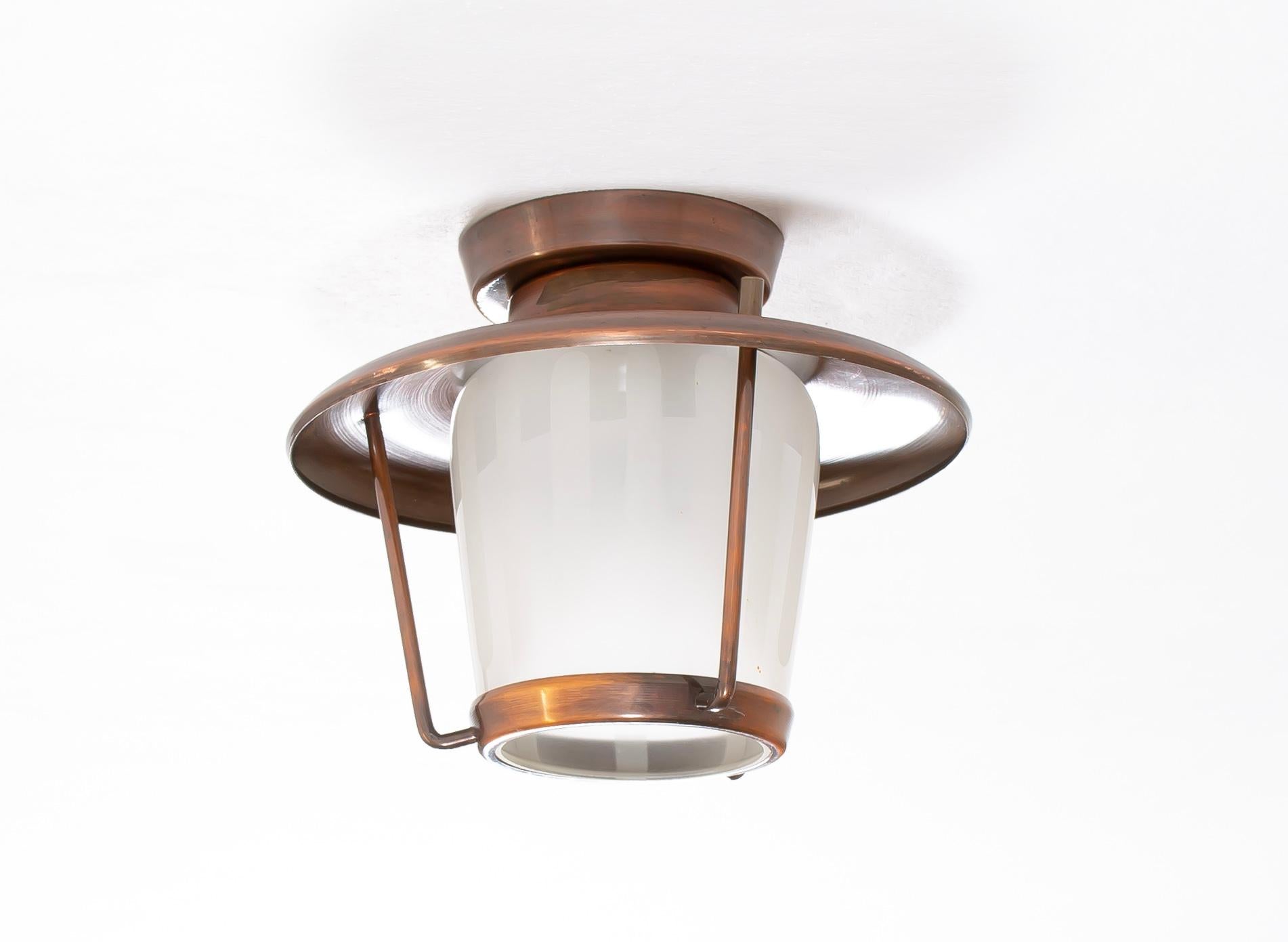 Sculptural outdoor ceiling light with a copper frame and shade in glass. Designed and made in Norway by Stavanger Metalkunst, from circa 1960s second half. The lamp is fully working and in very good vintage condition. With time hanging outdoors, the