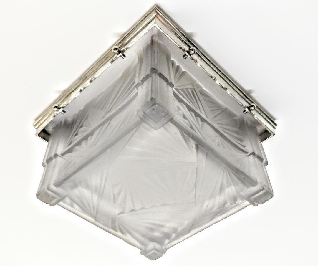 A French Art Deco Flush Mount was created by the French artist 