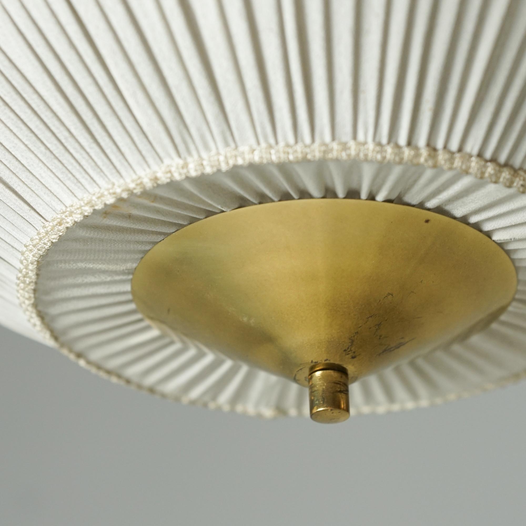 Flush mount, manufactured by Valinte Oy Finland from the 1950s. Brass with silk shade. Good vintage condition, minor patina consistent with age and use. Beautiful timeless Scandinavian Modern design. 