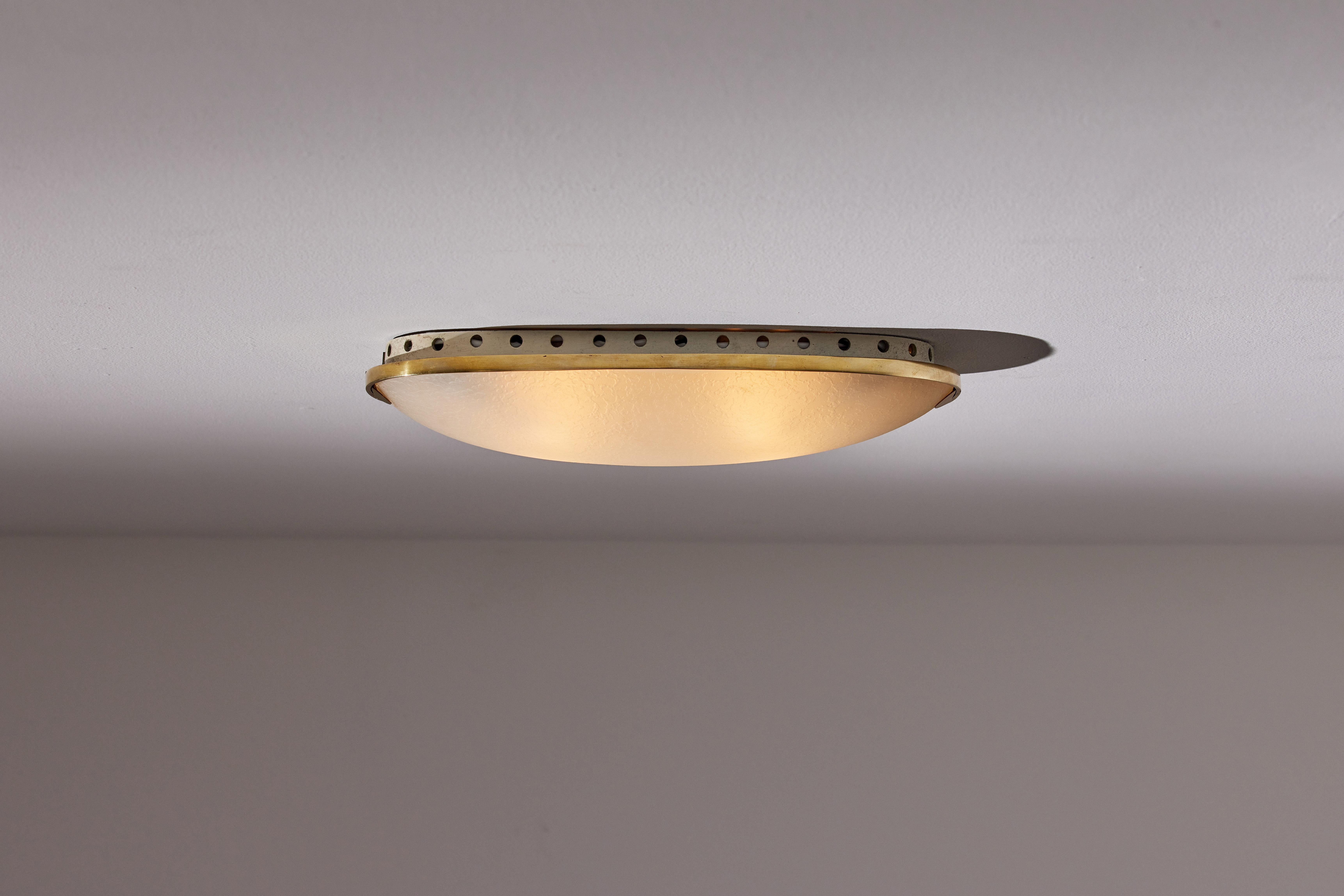 Flush mount wall/ceiling light by Fontana Arte. Manufactured in Italy, circa 1950's. Textured glass, brass. Rewired for U.S. standards. We recommend four E26 25w maximum bulbs. Bulbs provided as a one time courtesy. Height indicated is from ceiling