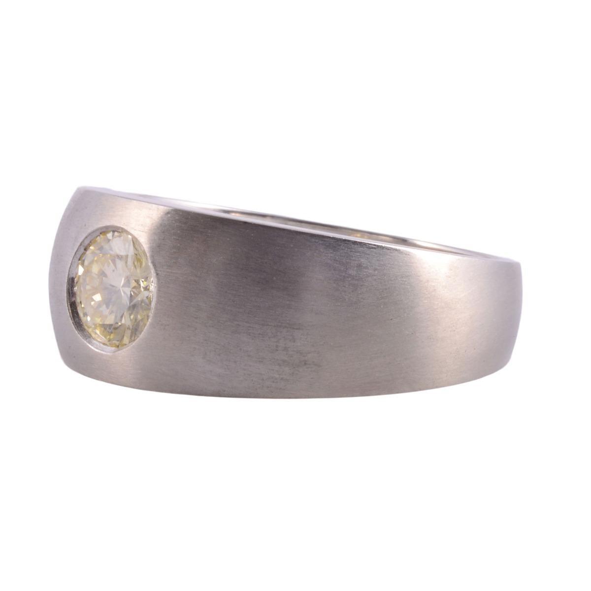 Estate flush set diamond ring. This 14 karat white gold ring features a flush set .80 carat round brilliant diamond. The diamond has SI1 clarity and is light yellow in color. This white gold diamond ring is appraised at $3,800 and is a size 8.25.
