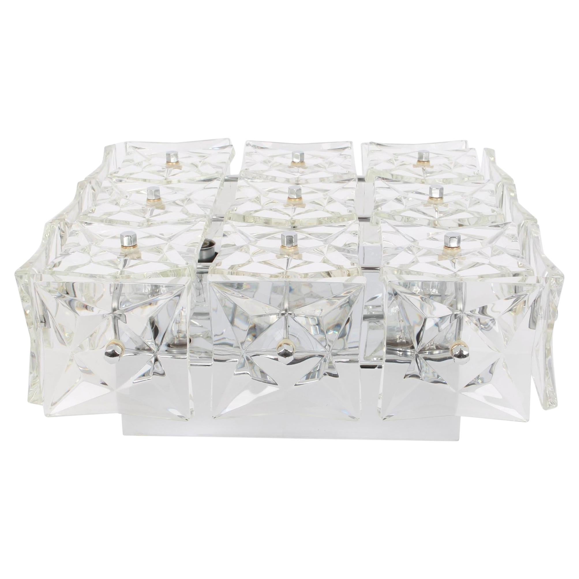 A stunning light fixture by Kinkeldey, Germany, manufactured in circa 1970-1979. A handmade and high quality piece. The fixture is made of chrome frame and with lots of facetted crystal glass elements.
Measures: Diameter 14.9 in /38 cm
Height 5.9 in